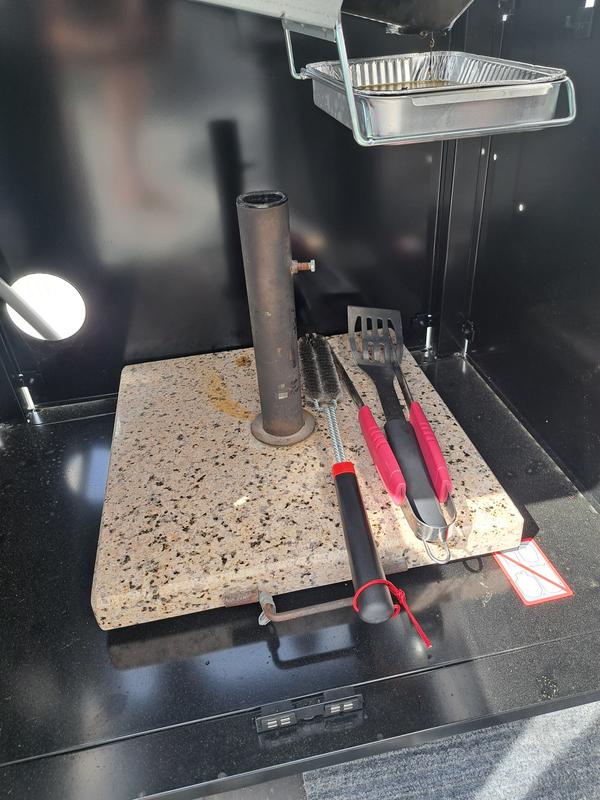 Placed weight in storage area to prevent future blow overs