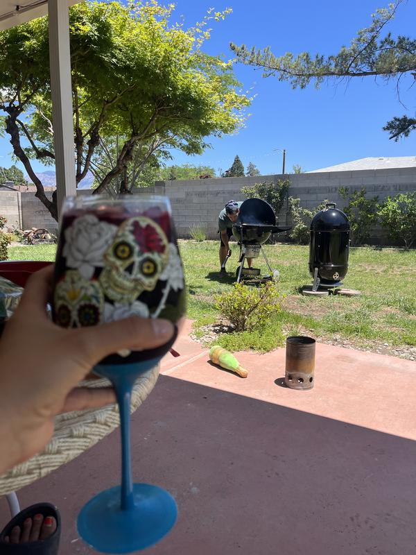 Lounging while the WSM maintained temperatures compared to the kettle grill EASILY