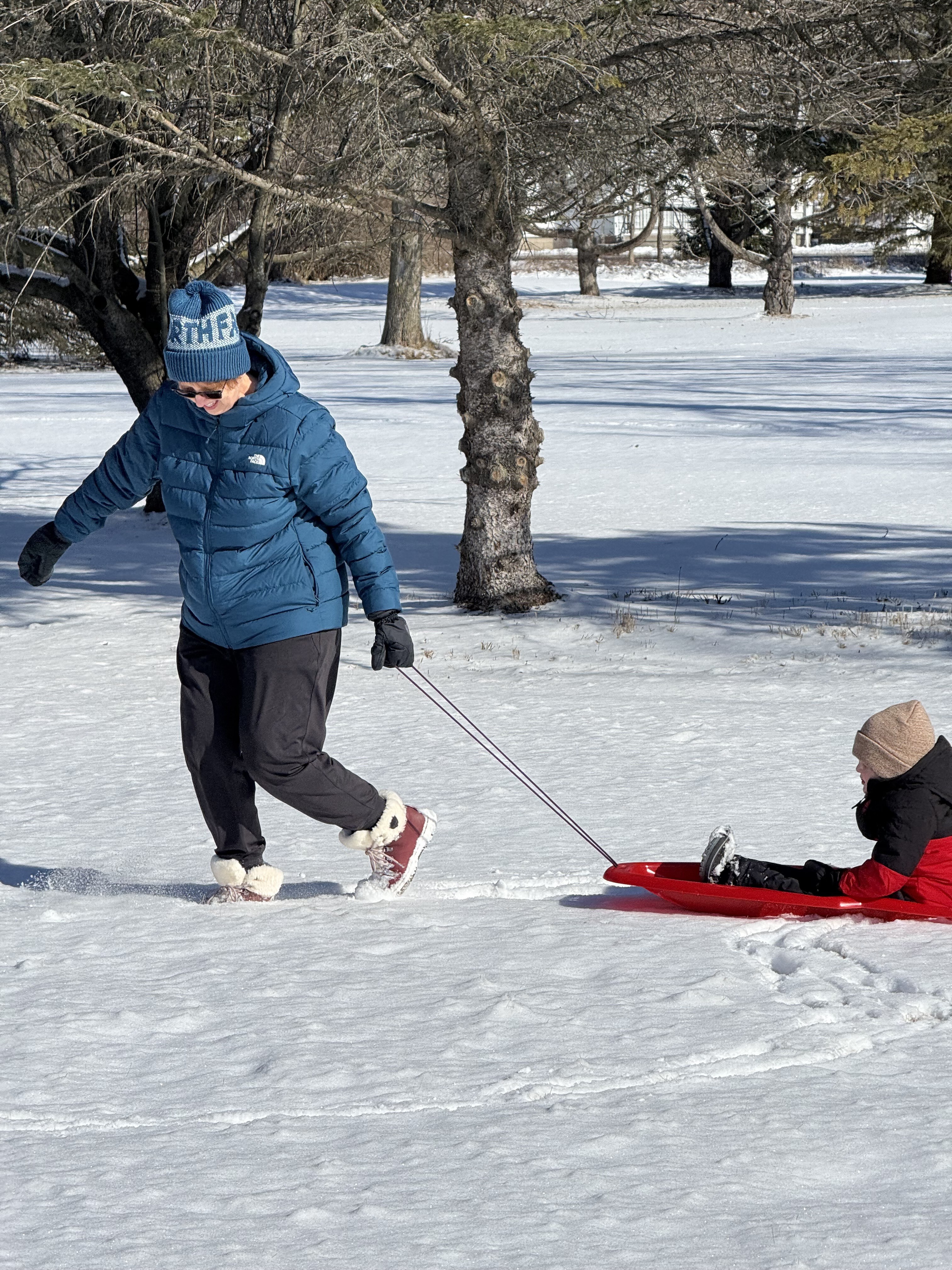 My grandson and I sledding during a cold winter day!