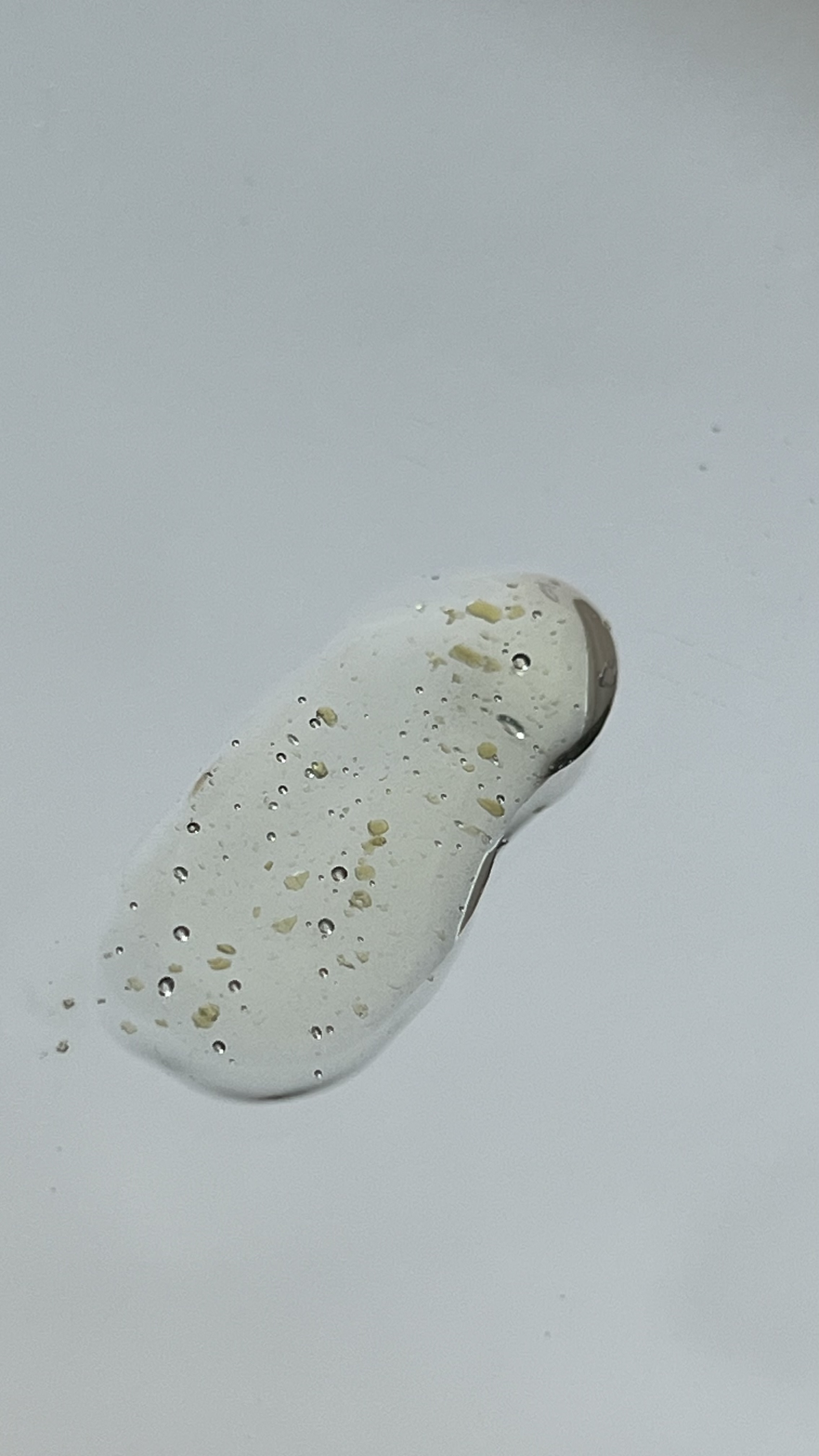 The texture is light and looks like small drops of gold.