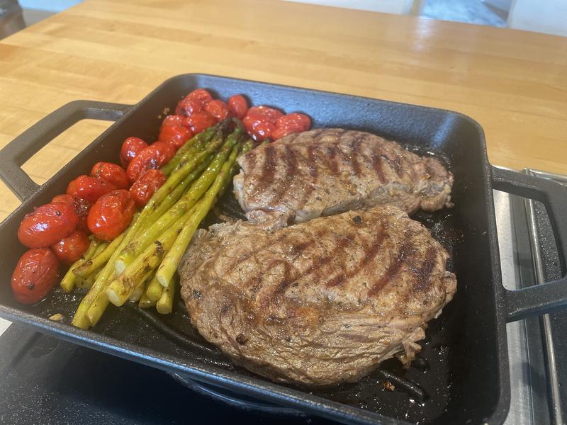 Grilled ribeyes, asparagus and tomatoes