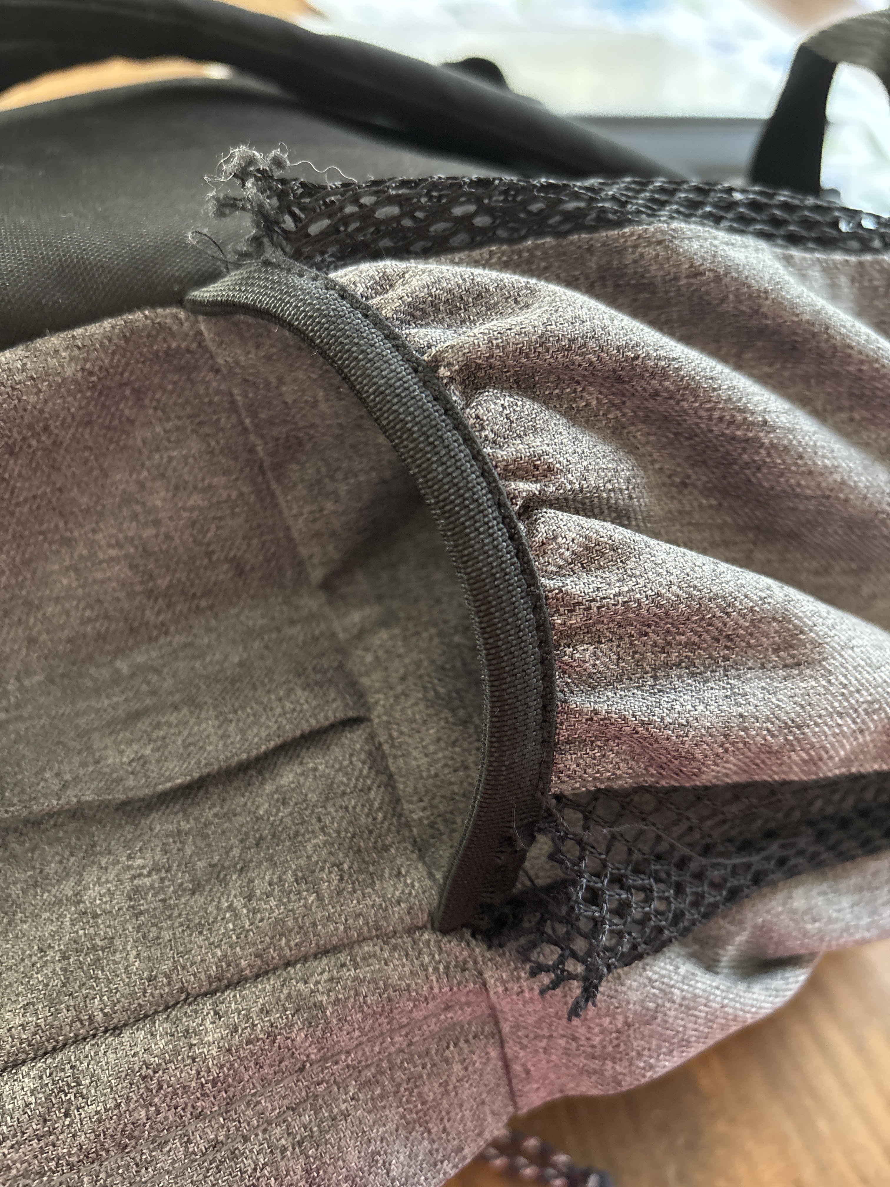 Torn mesh on side pocket