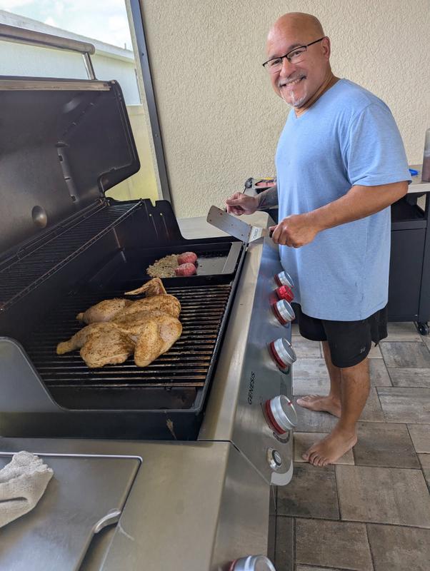 My husband enjoying his grill