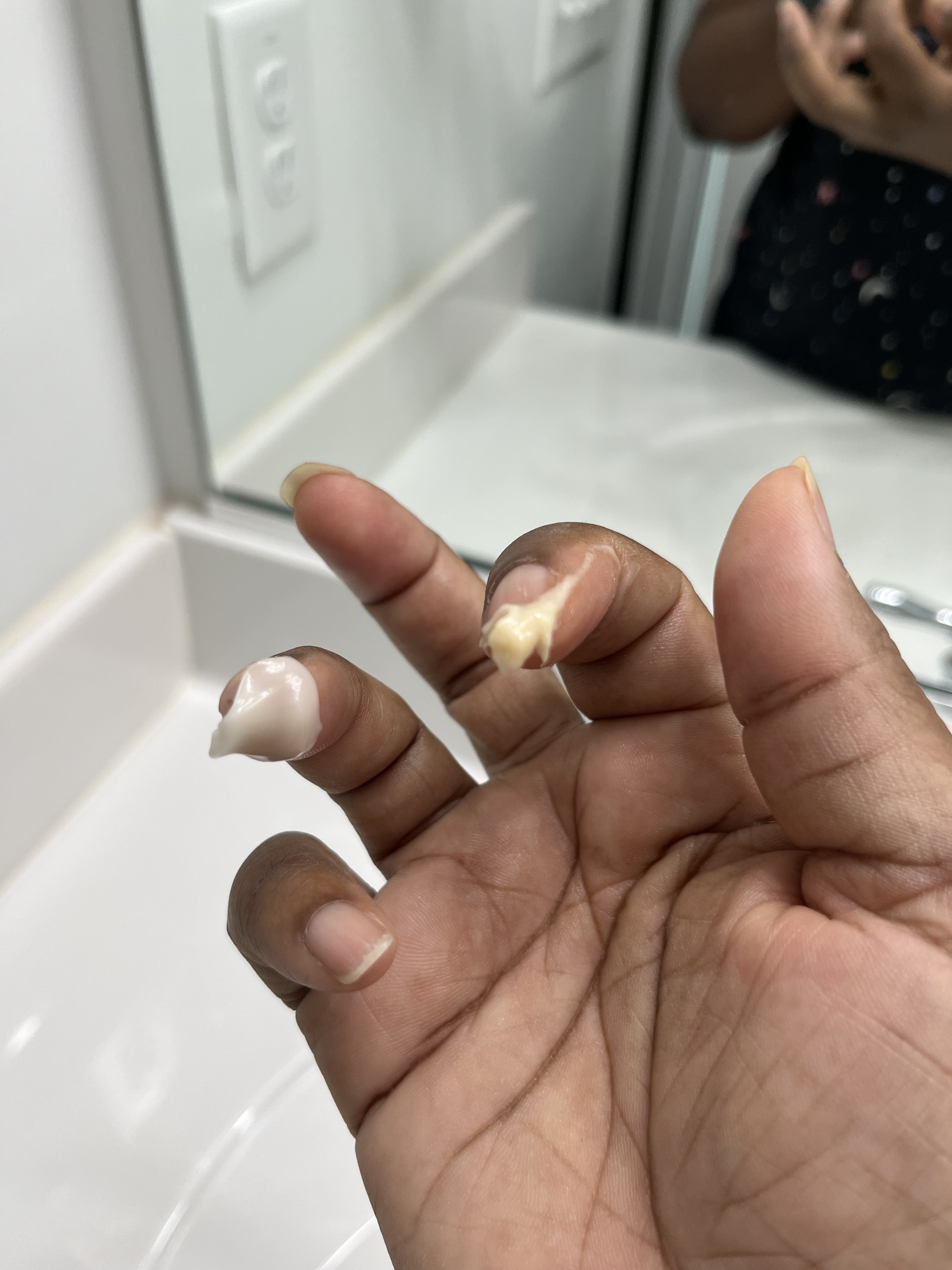 Thicker and darker is from old jar. Left my face glowing. New jar leaves my face ashy.