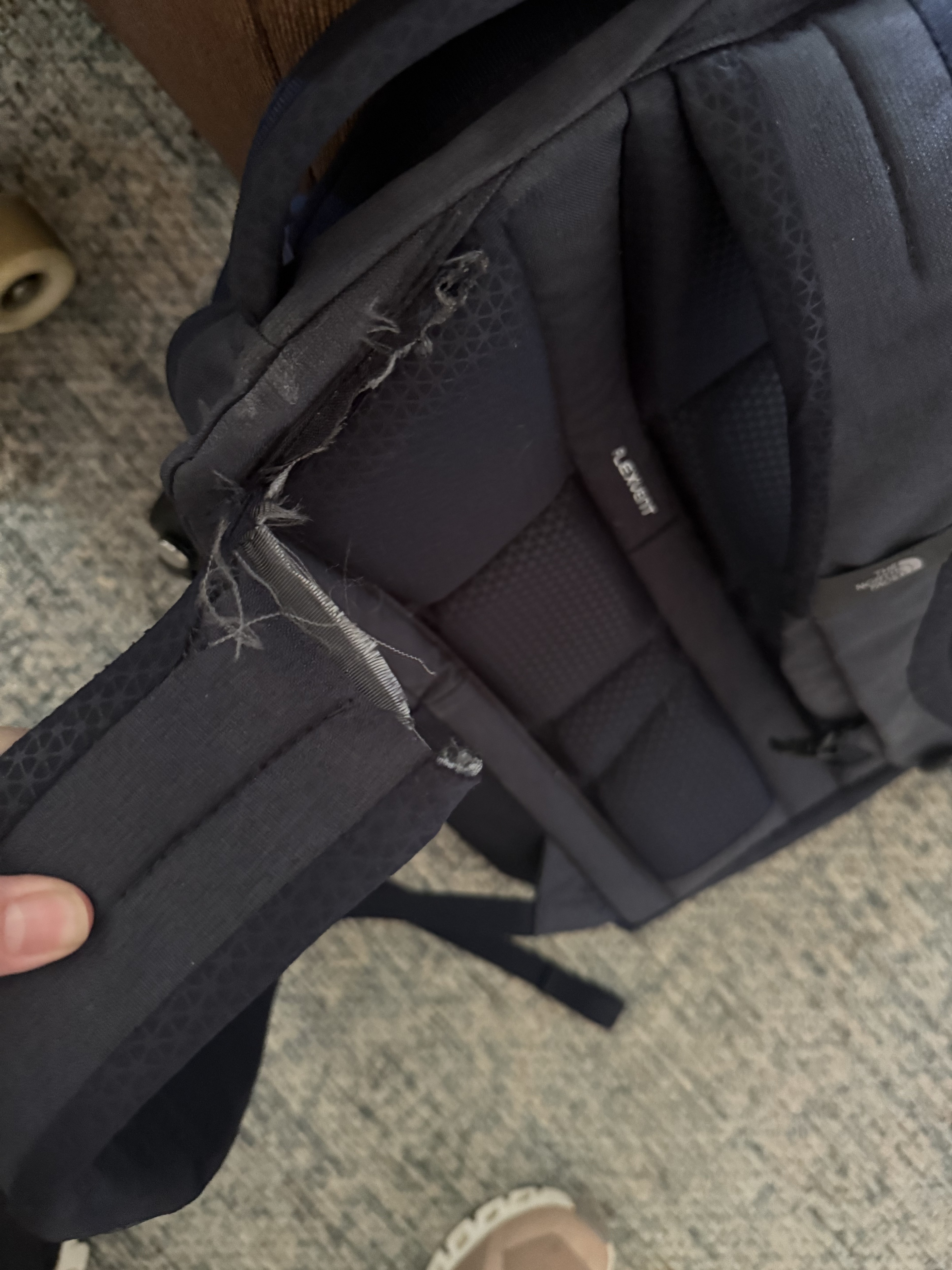 All he did was pick it up off the floor. It's only got a laptop and 2 spiral notebooks in it.