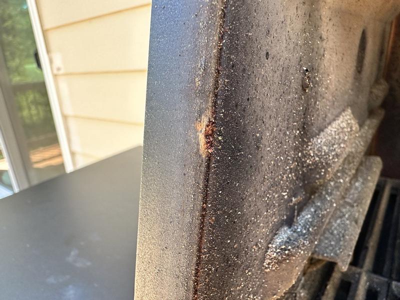 Rust spots on edge of front opening.