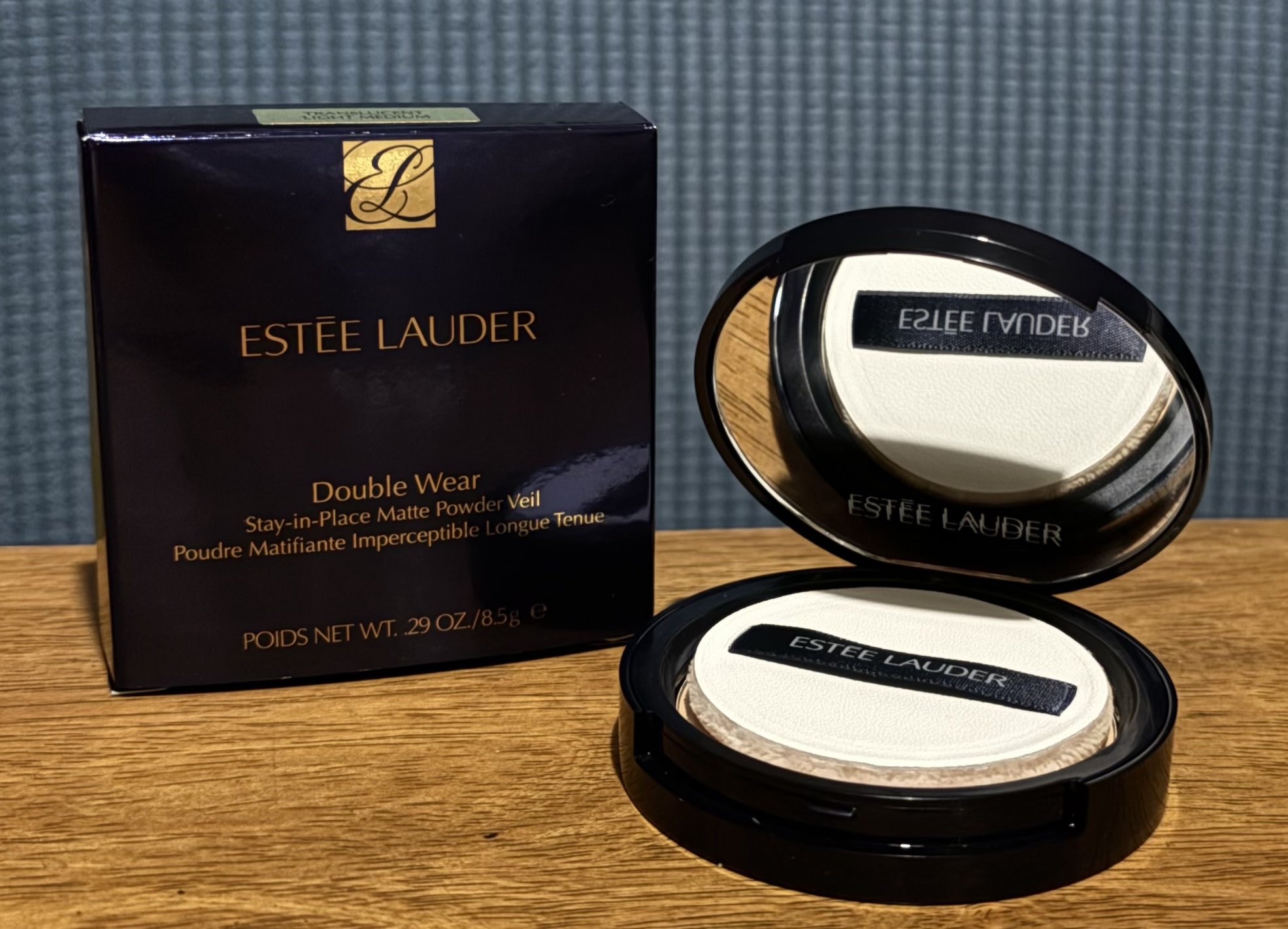Box and open compact of the Estee Lauder Double Wear Stay-in-Place Matte Setting Powder Veil.
