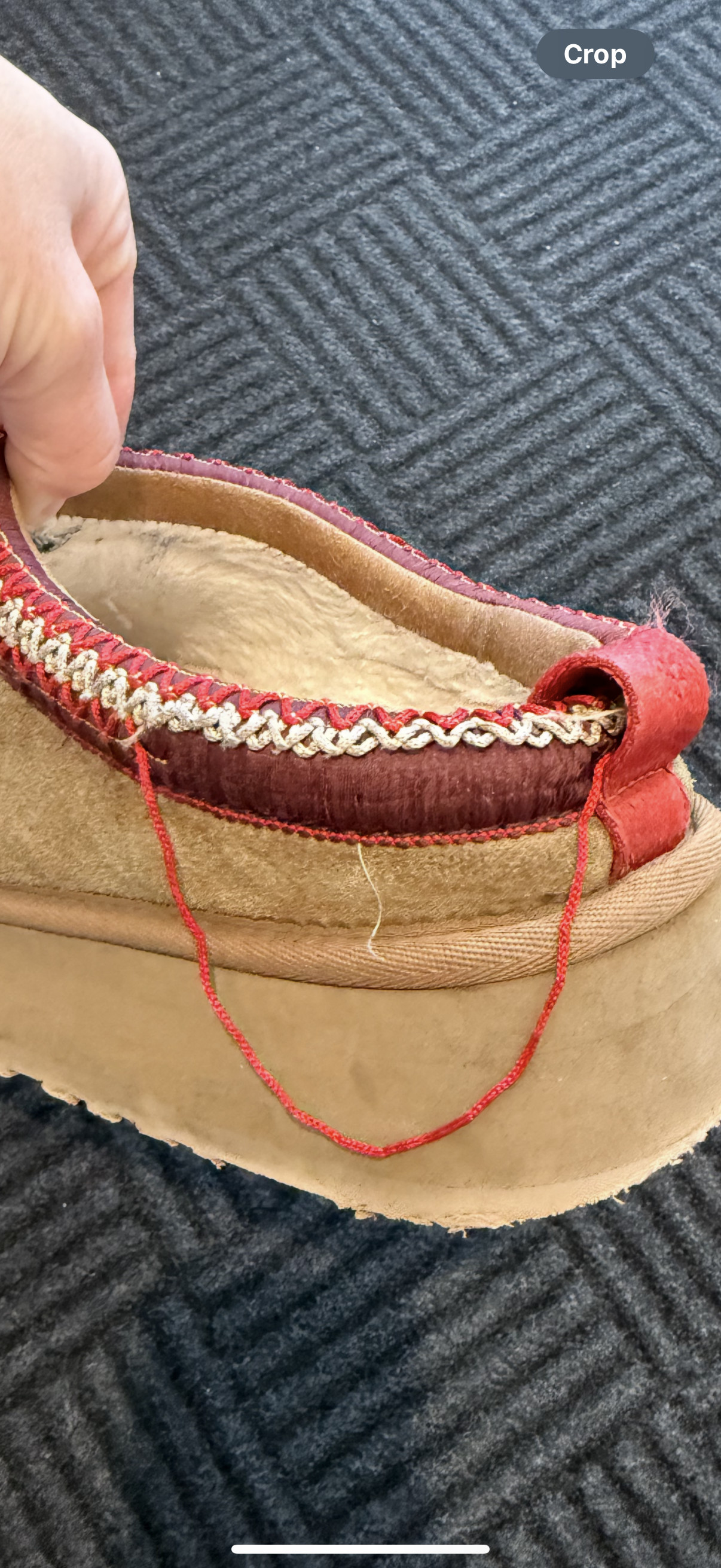 Completely hanging off the shoe