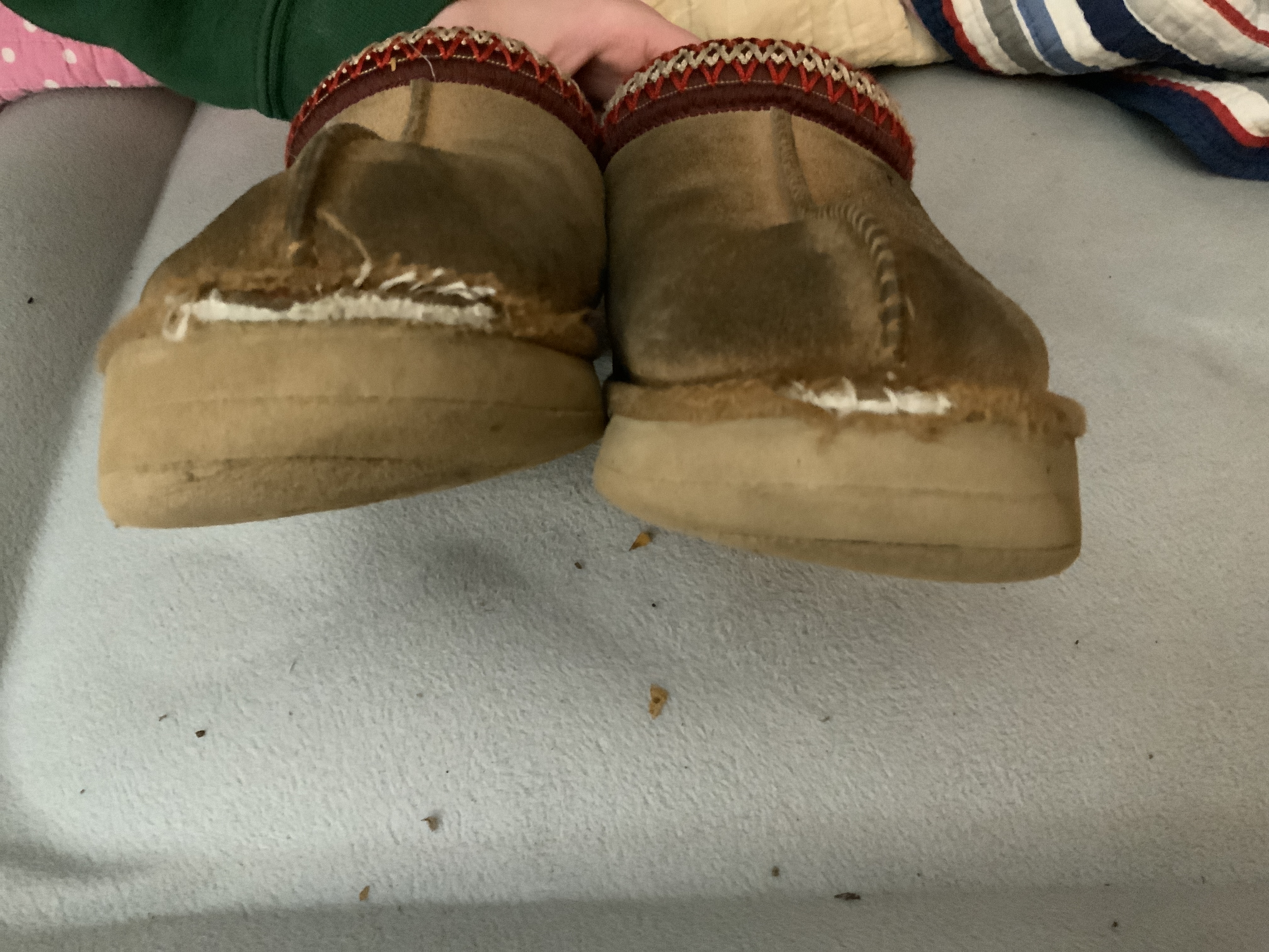 Notice on one side it's worn to top layer of rubber & other still has 3 layers. Material at Toes worn to. NO OTHER UGGS WE HAVE OWNED HAVE EVER DONE THIS