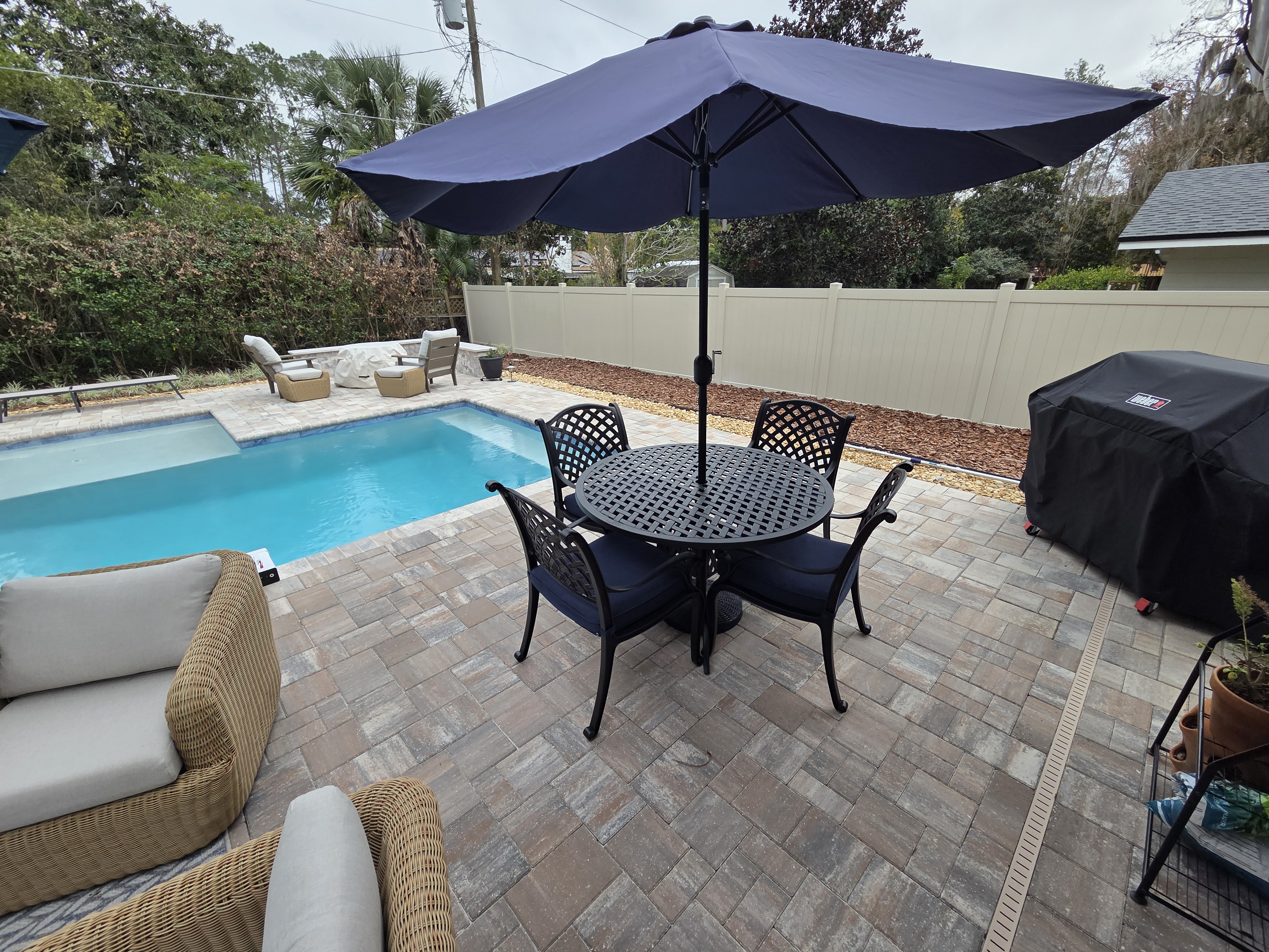 BBQ Guys outdoor dining set with chairs and umbrella