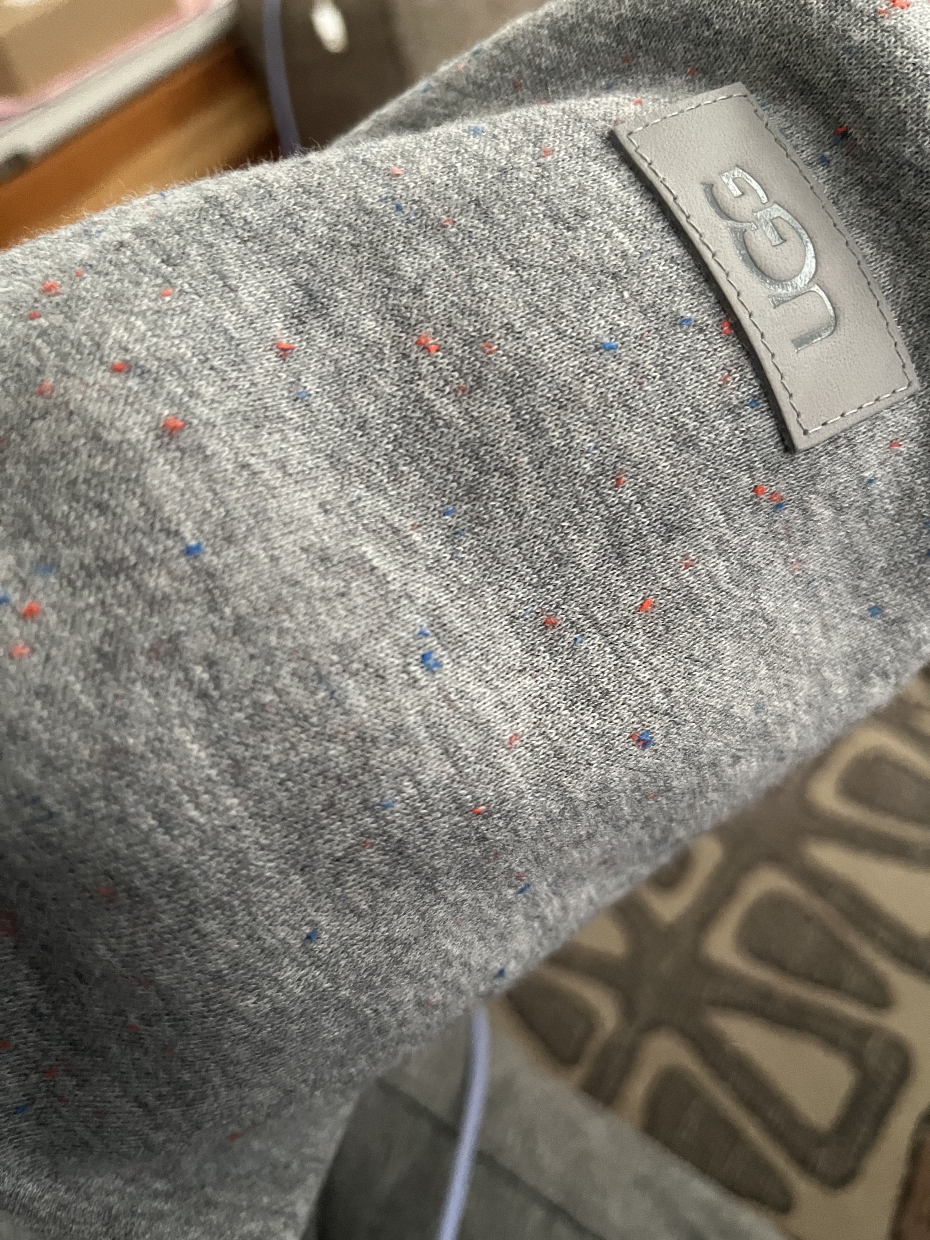 You can see hints of color woven into the gray fabric.