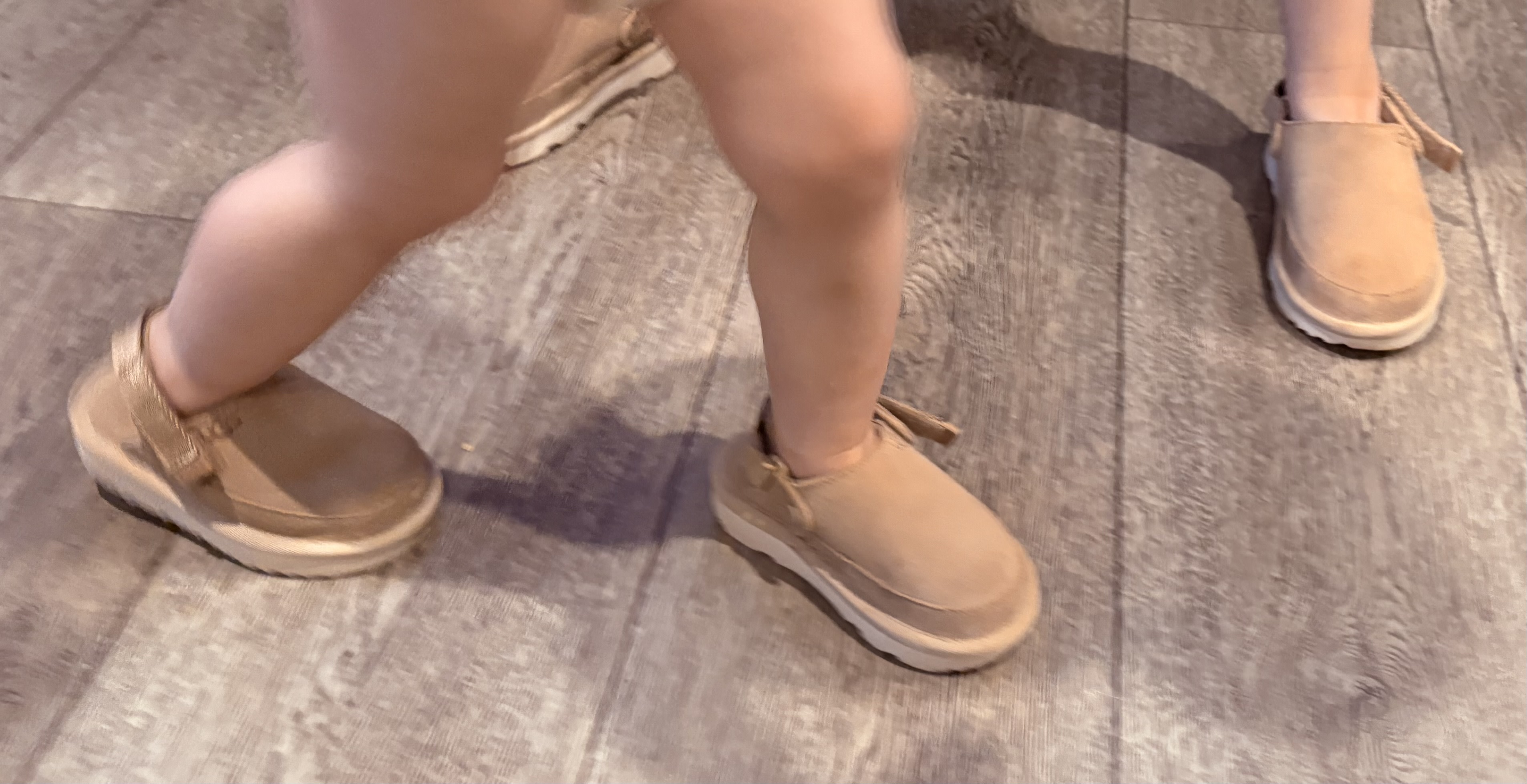 My grand princess littles wearing their UGG CLOGS