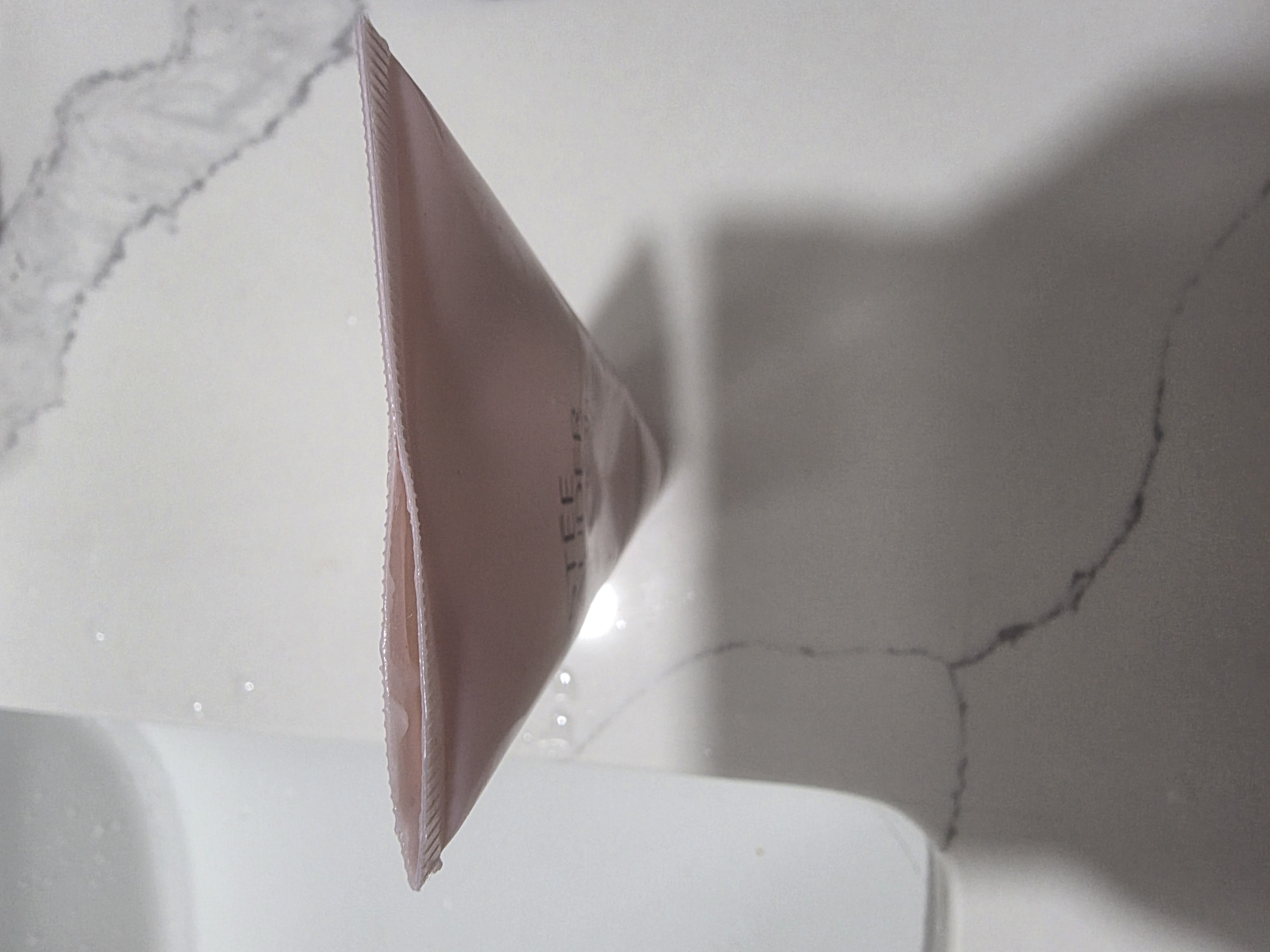 When squeeze,  bottom pop open