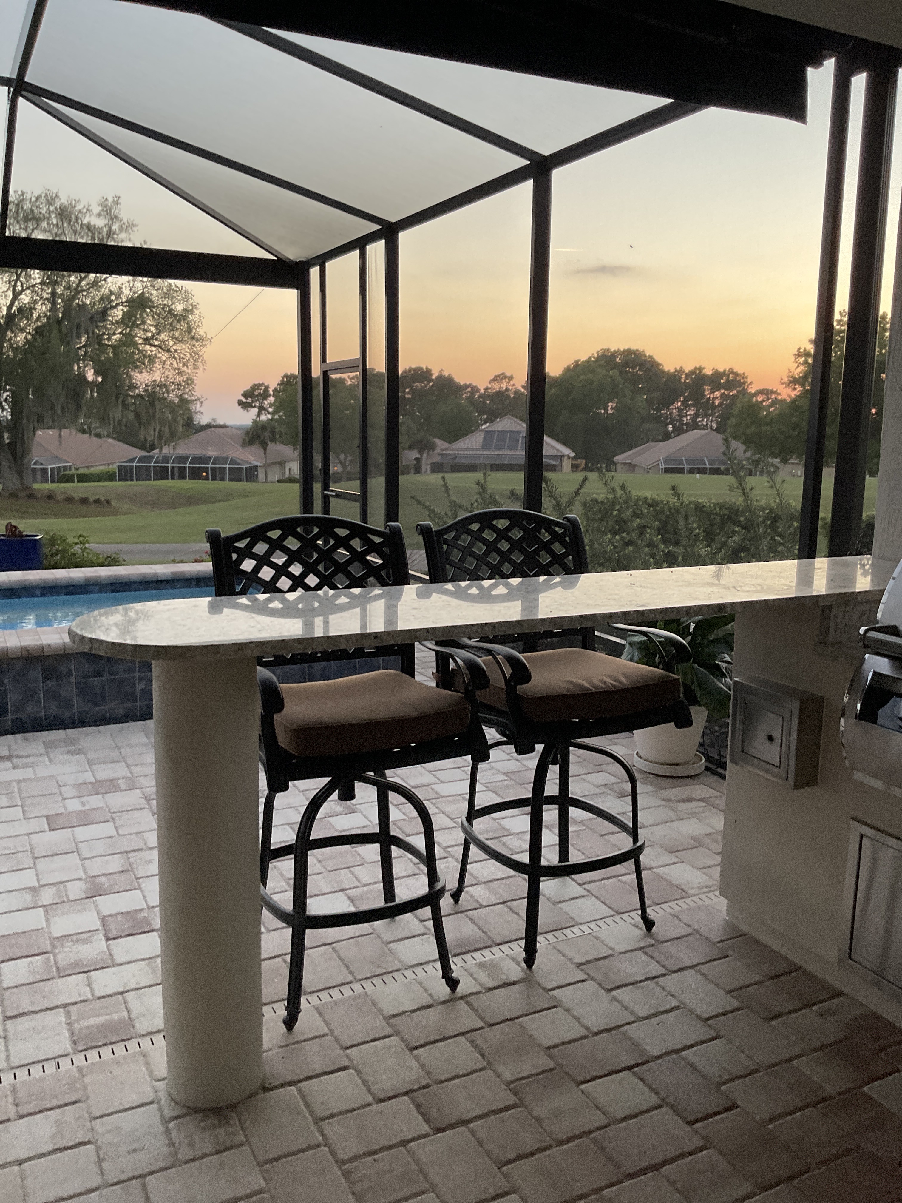 Bar chairs by the grill