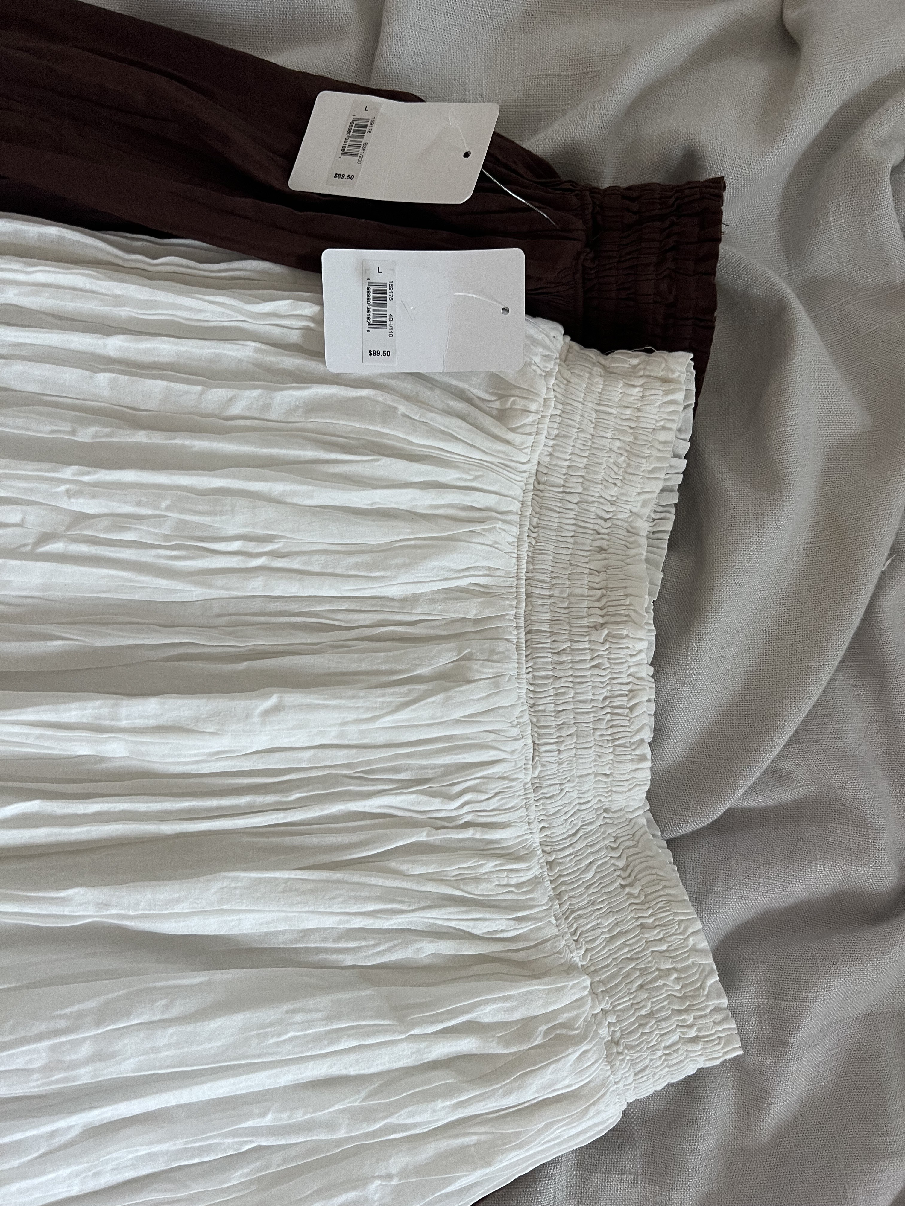 Both are labeled on the price tag and internal label as large