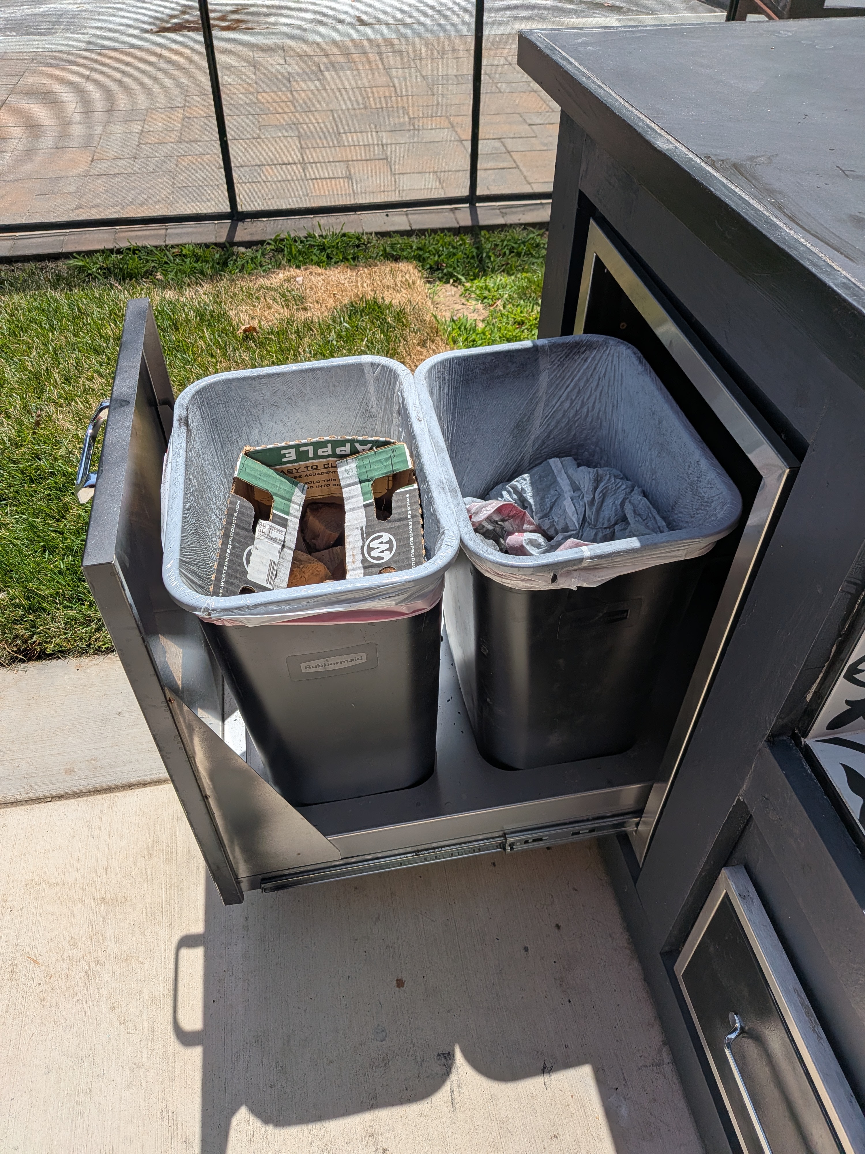 Two large trash bins