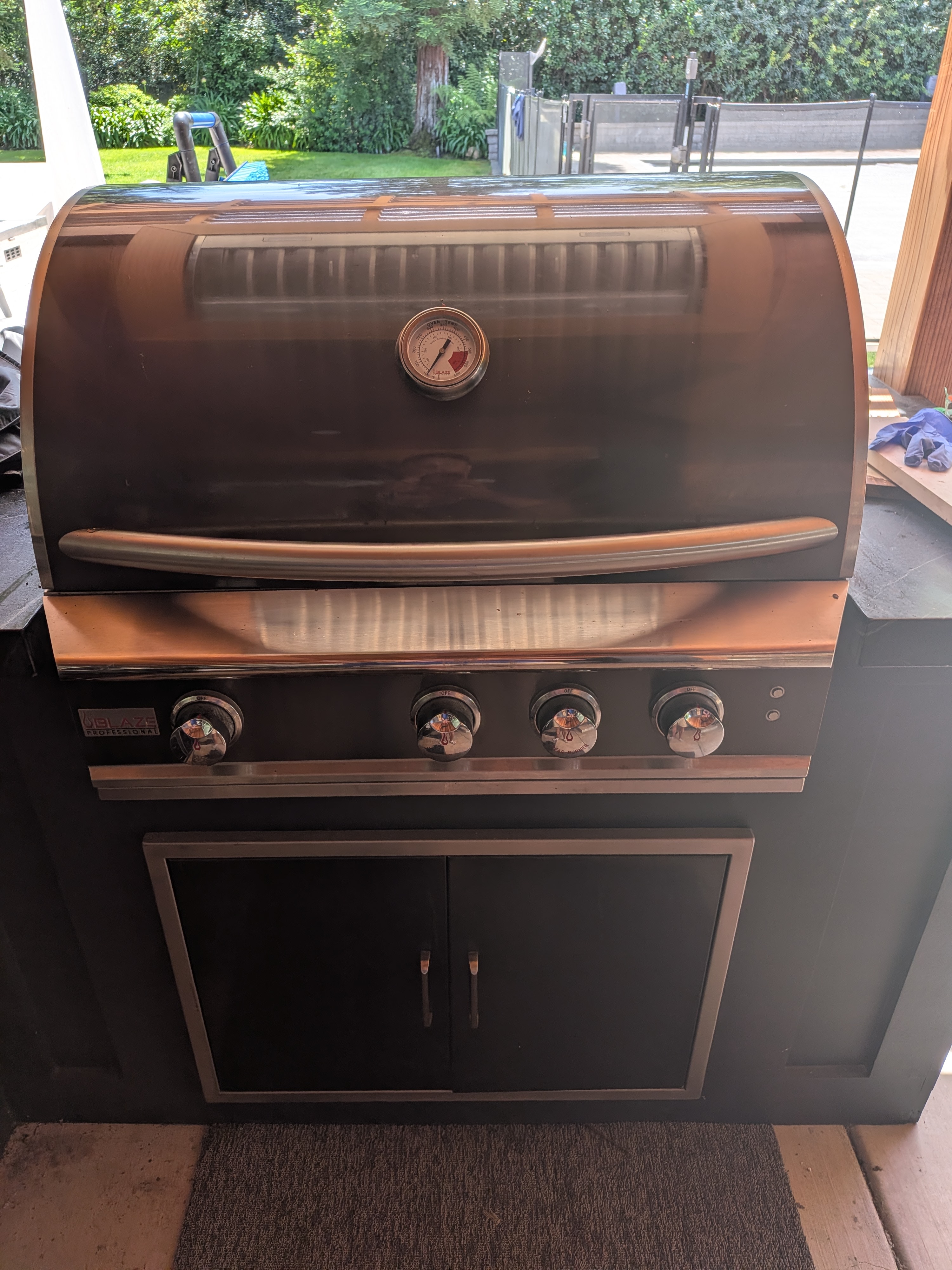 My Pro Lux 34" with a black skin, matching black cabinet below