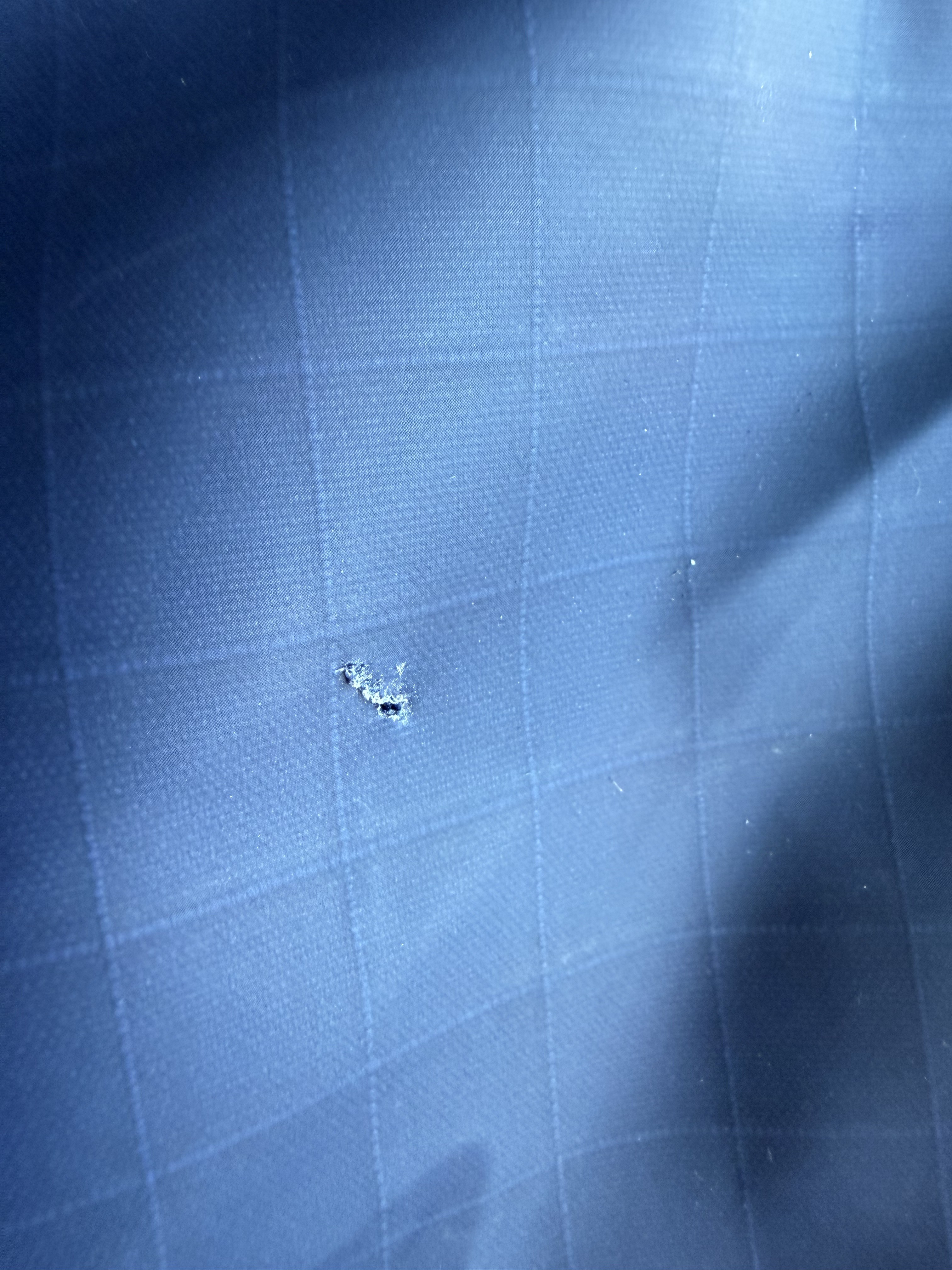 Tear forming on top showing how poor the vinyl is. Due to my laptop being stored in that pocket