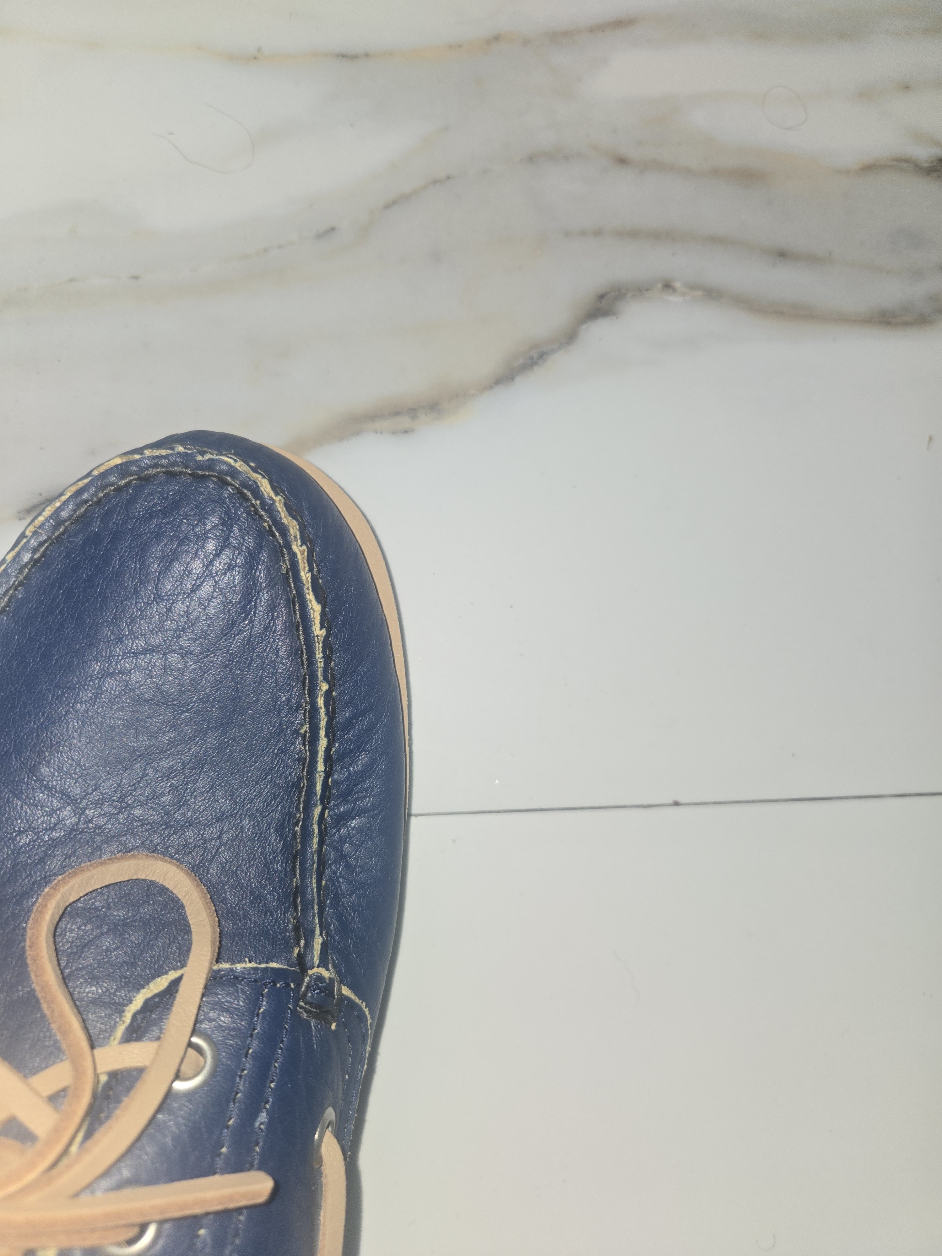 Display of larger sole compared to shoe that sits on it