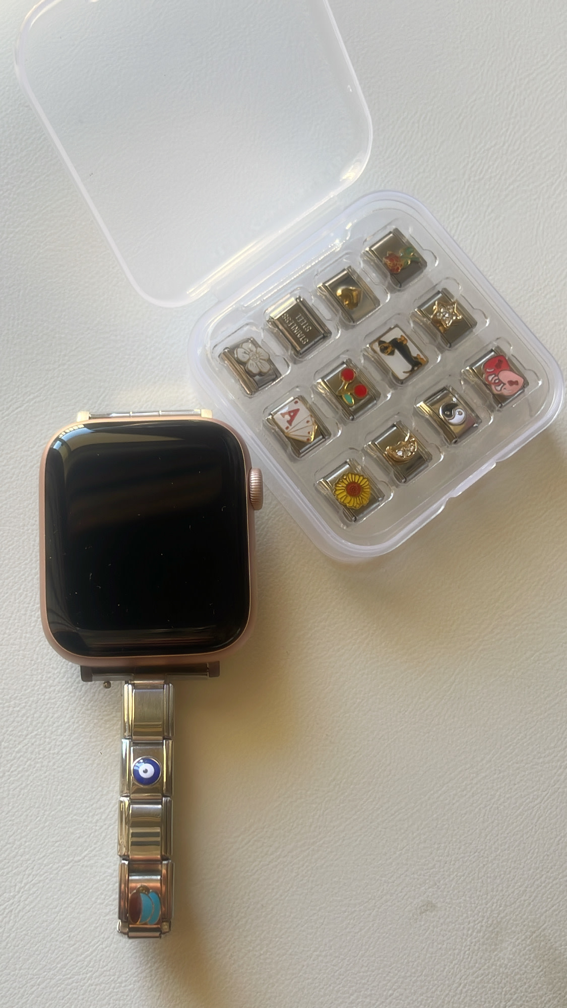 Front of watch, extra design pieces on the side