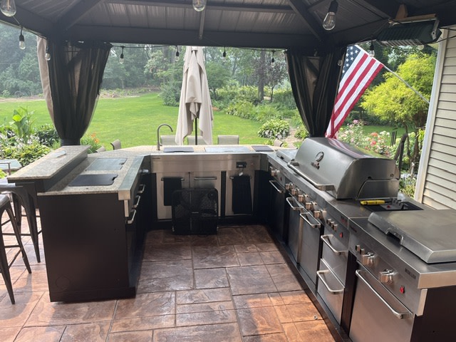 The unit is on the left side of Island and we plan on adding one more with bar top.