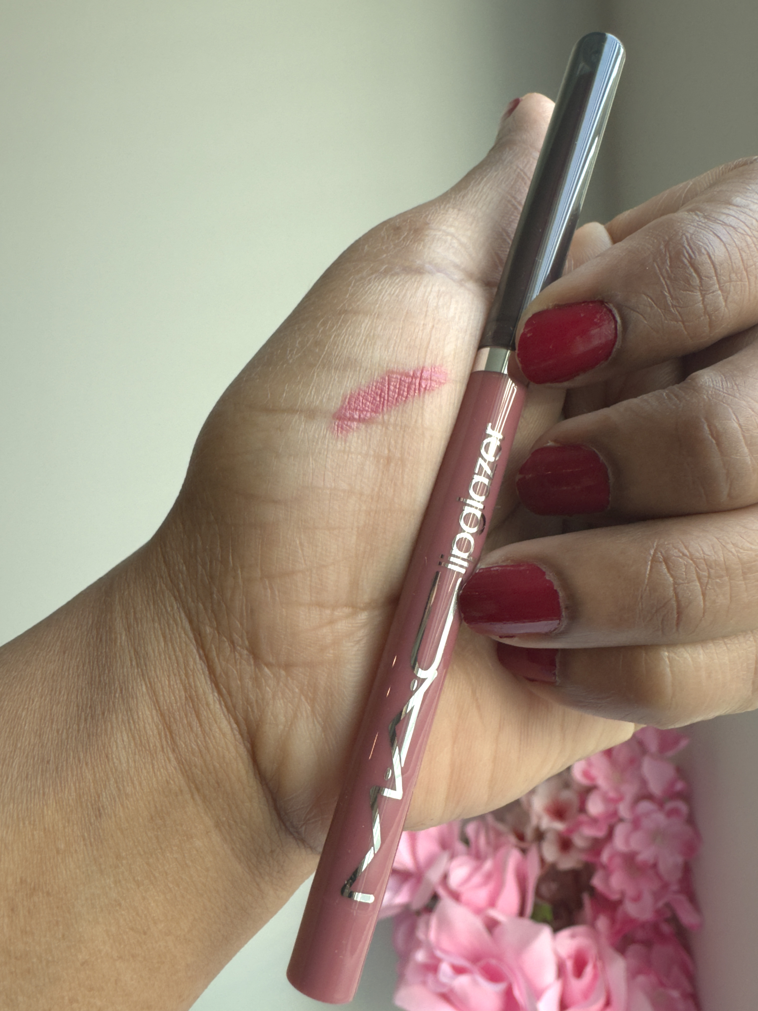 Beautiful rosy nude shade with a glossy finish.