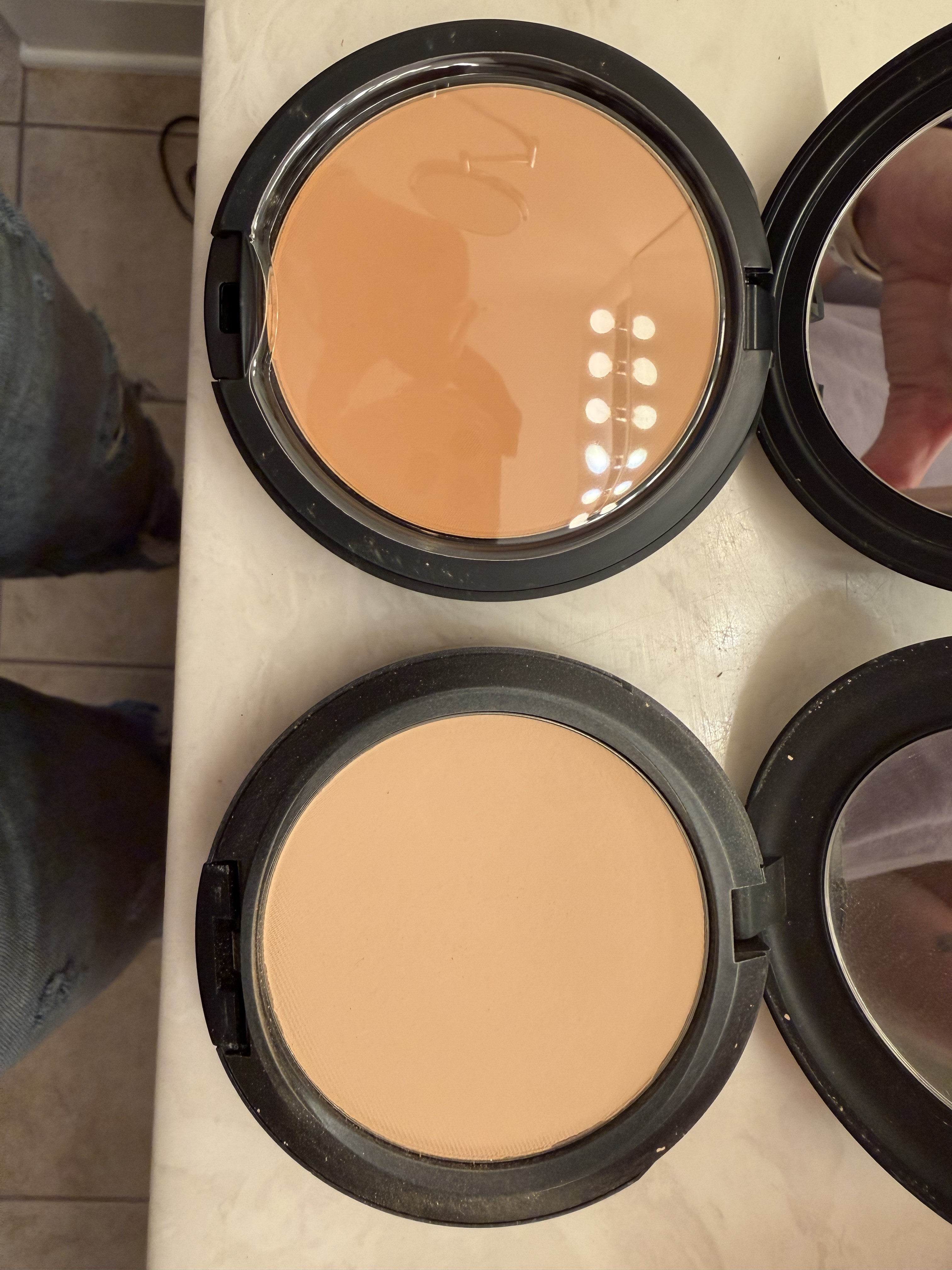 My compact is on the right and the new one is on the left.