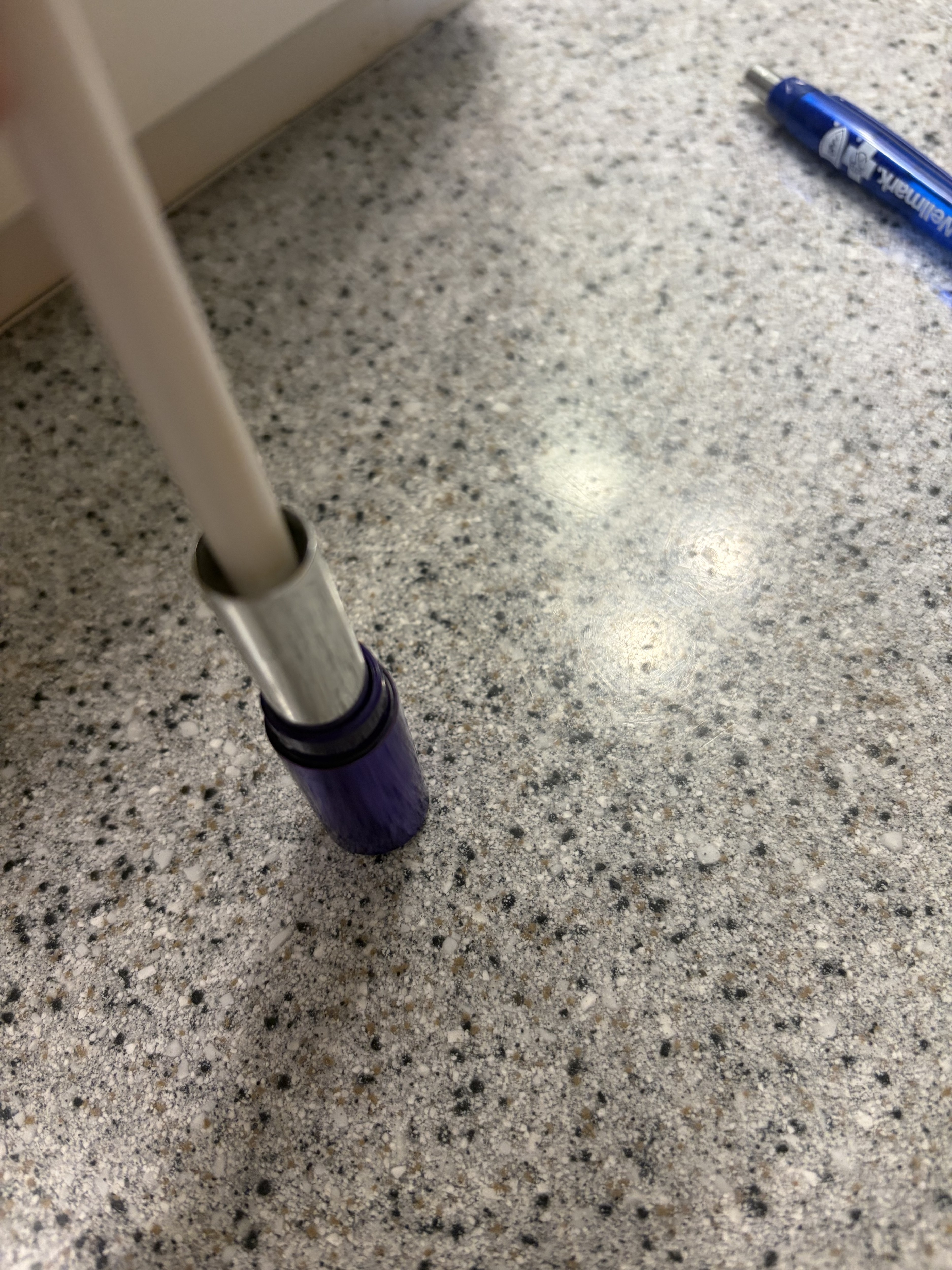Inserting my brush tip into the almost empty container