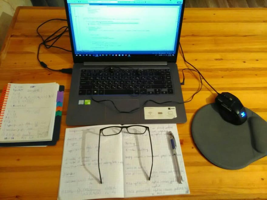Laptop with glasses and headphones