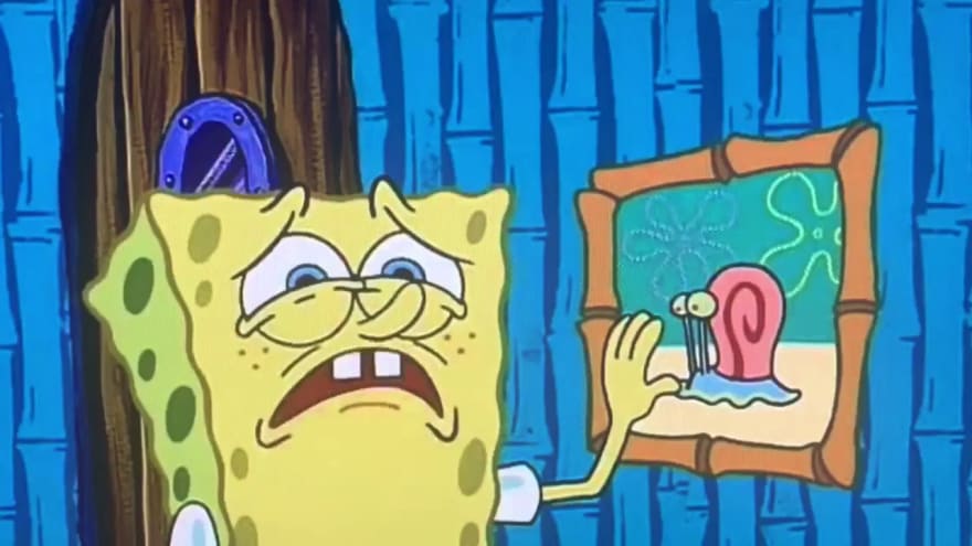 Spongebob touching a picture of Gary