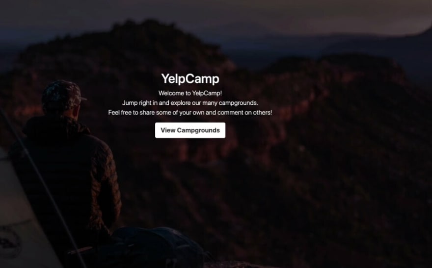 Yelp Camp landing page with panoramic photo of person looking at mountain vista