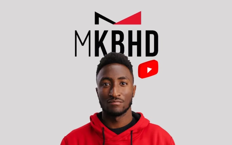 A photo of Marques Brownlee with graphics of a YouTube logo and his handle "MKBHD"