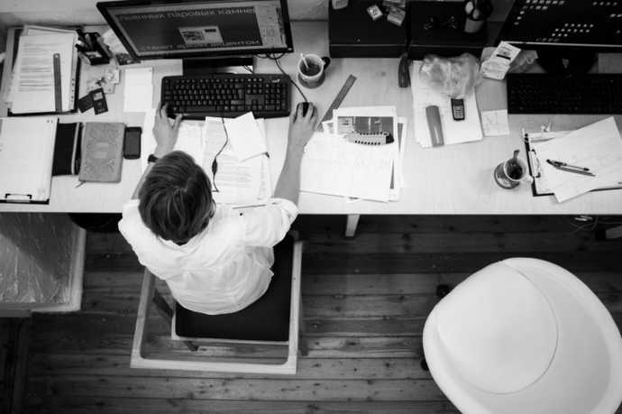 overhead view of a person working on a computer