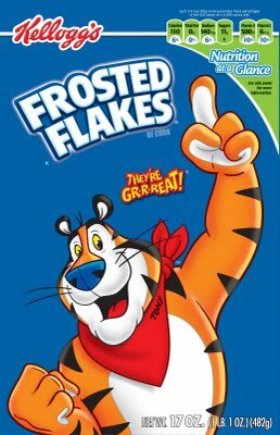 The front of a box of Kellogg's Frosted Flakes cereal. It says Frosted Flakes above an anthroporphic tiger named Tony gesturing energetically with 1 finger pointing towards the sky and his other hand clenched into a fist while saying They're Great but rolling the R