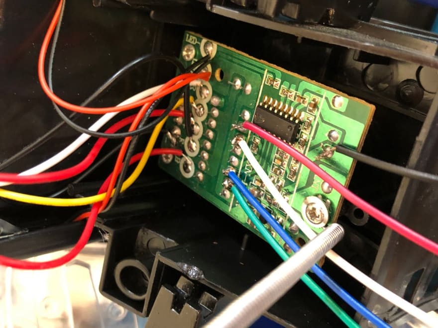 Image of inserting the motor controller back into the Tumbler chassis.