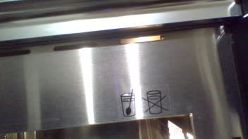 Icons on the microwave : heat water with a spoon in it. There is a glass of water without a spoon with a cross through it.