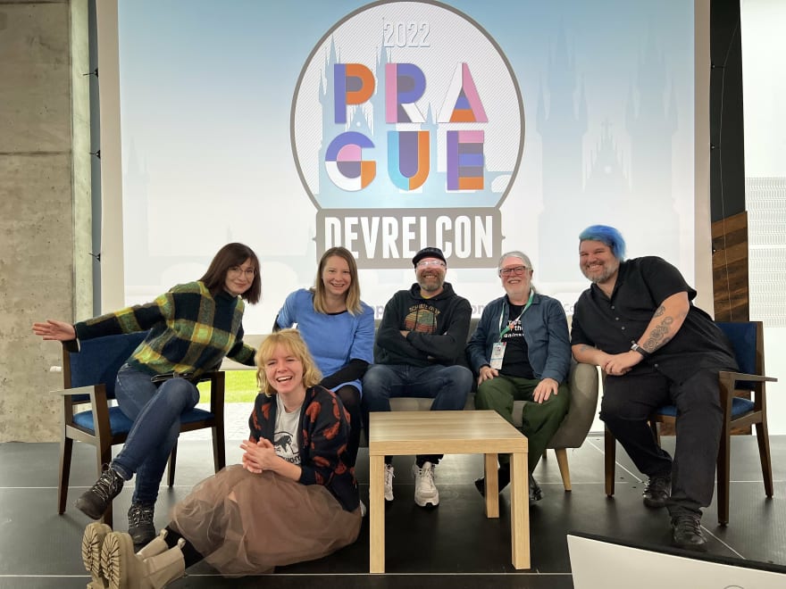 Group photo of the Aiven DevRel team, on the DevRelCon stage