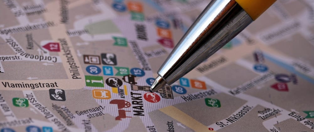  A folded map with a yellow pen pointing at the Markt (Market) area with a search result for 'Android offline map applications' in the background.