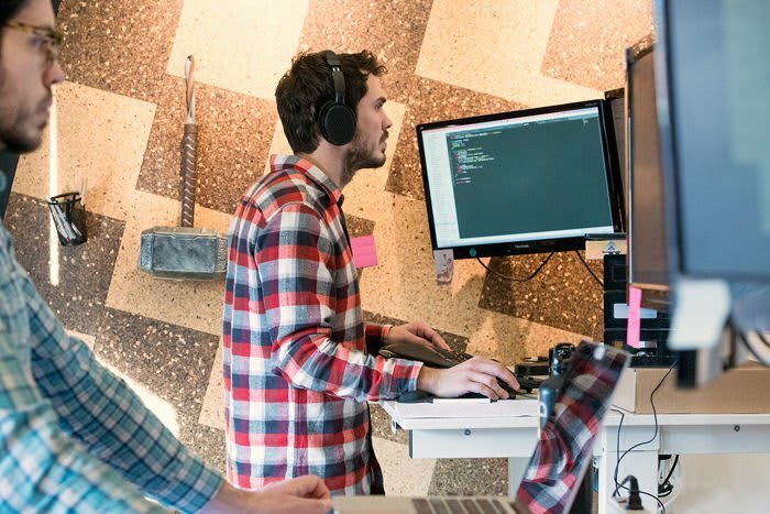 Don and Ricardo Working at Their Desks