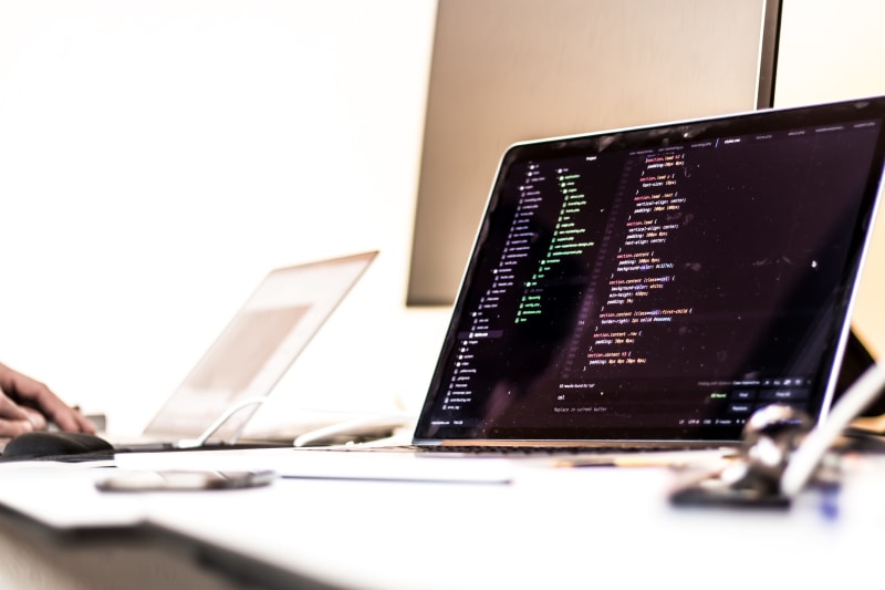 Laptop with a CSS file opened in a code editor.