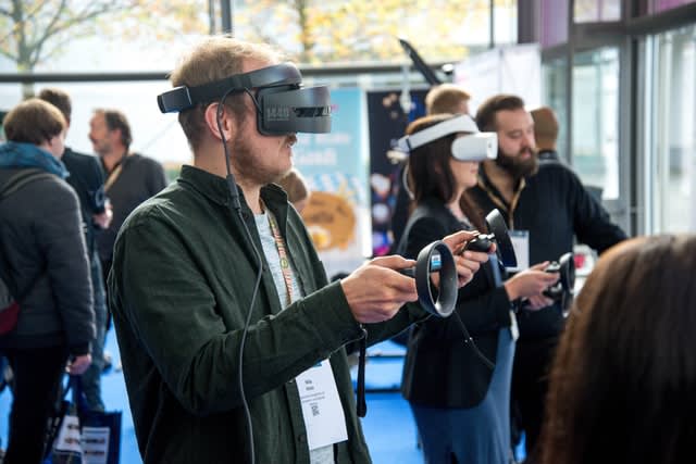 room of people wearing virtual reality glasses