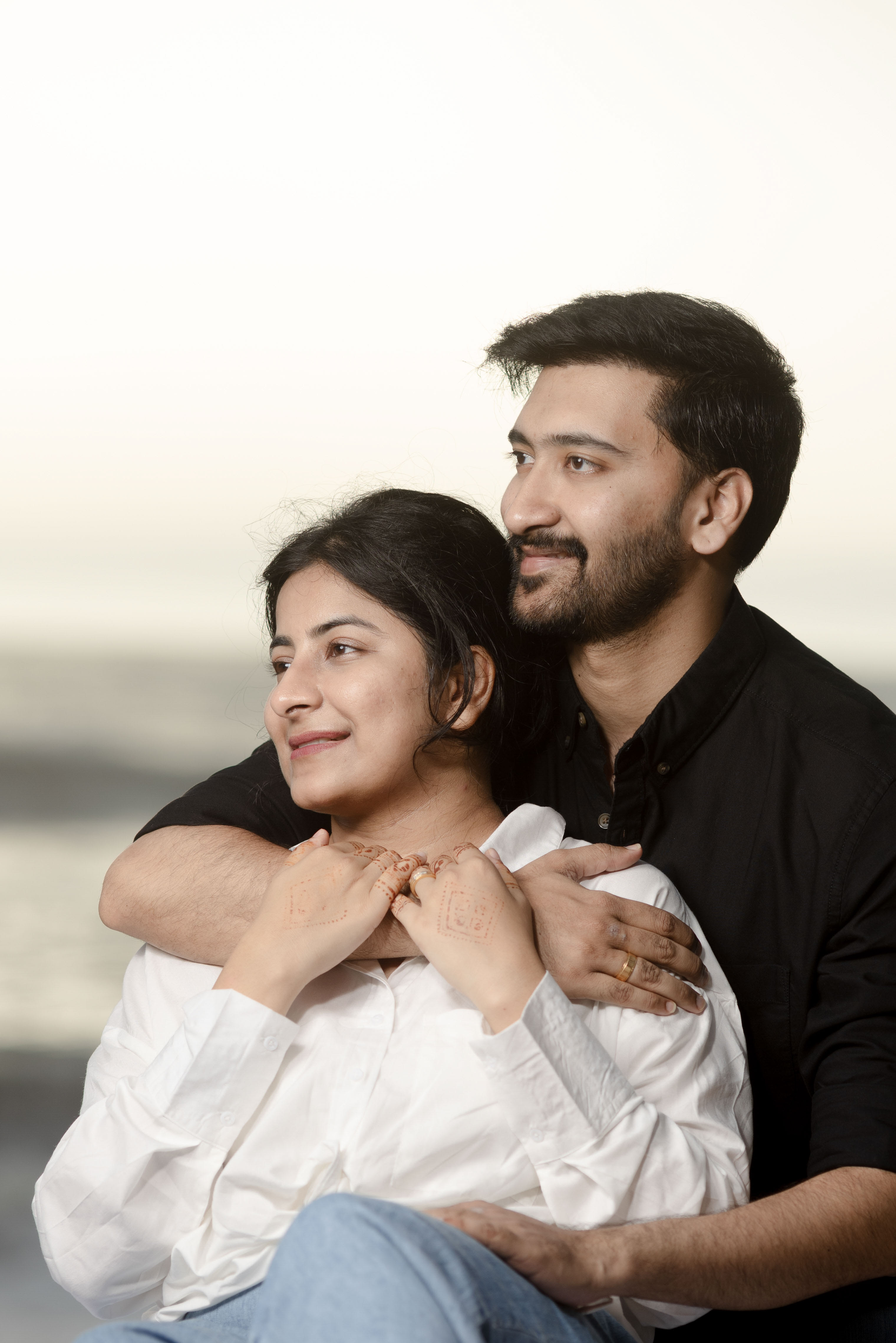 Couple posing stylishly for beach outdoor photoshoot with soft natural light