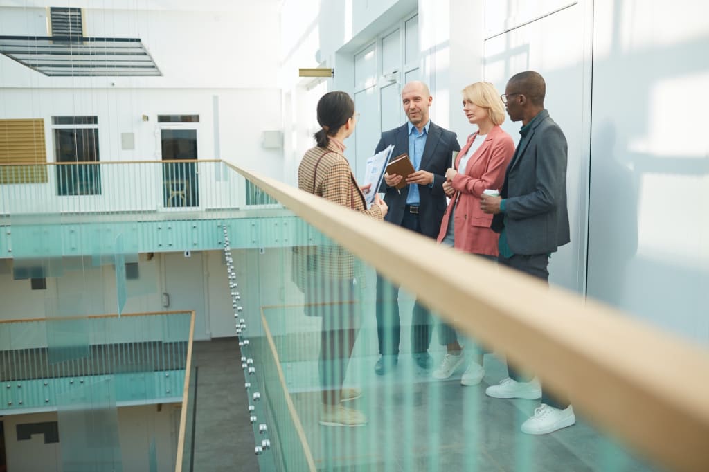 Hire a Website Designer 13 Business team meeting at office building