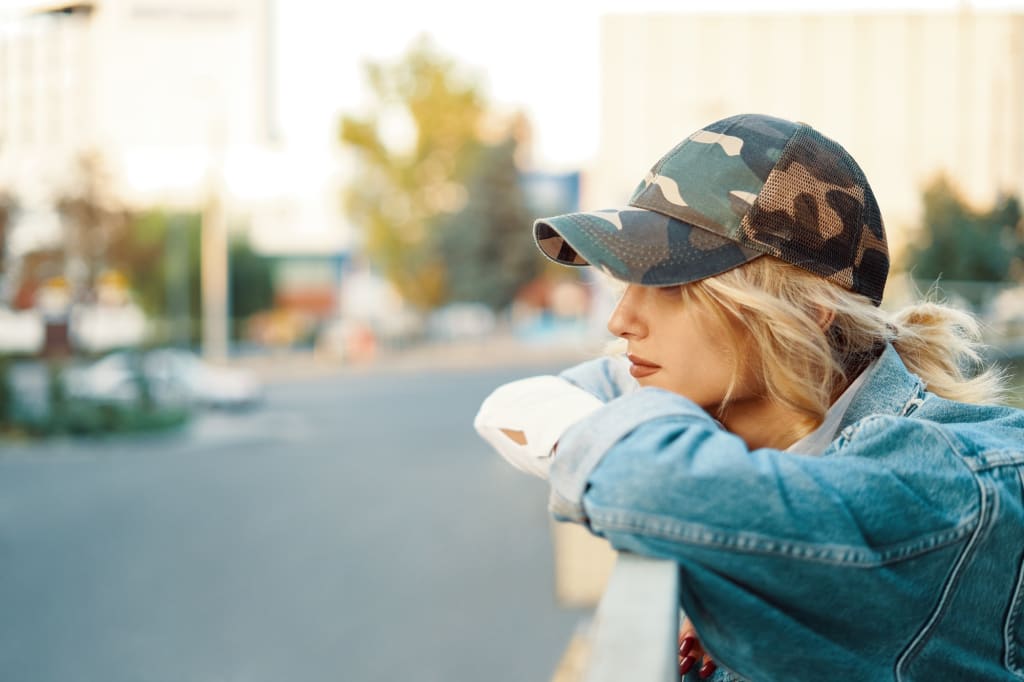 Hire a Website Designer 8 Casual dreamy girl watching the city from a higher point