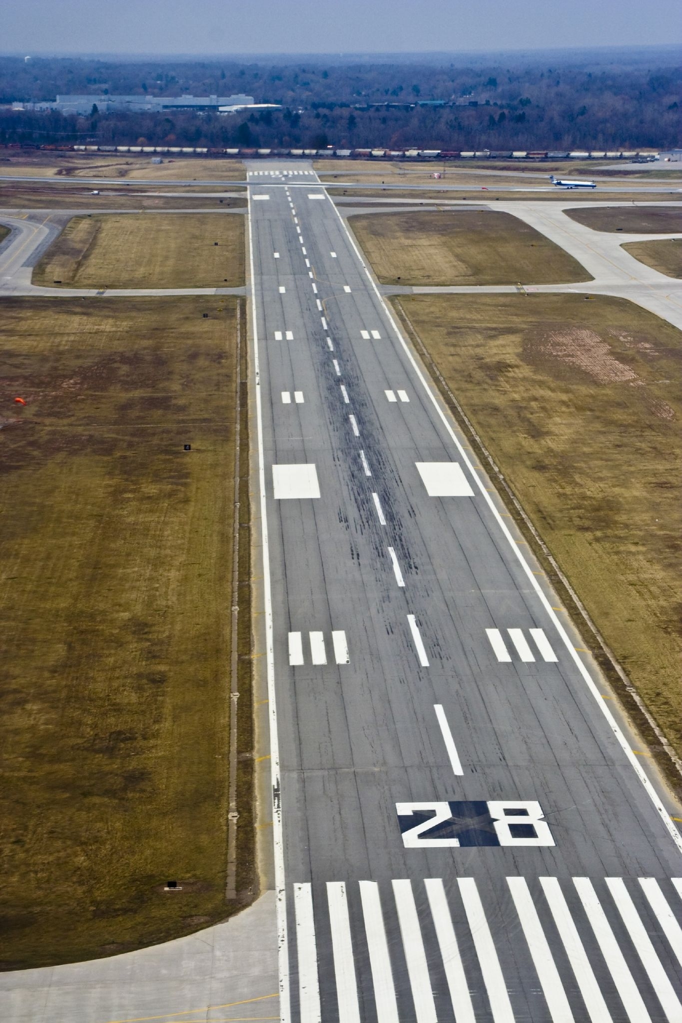 airport runway with plane