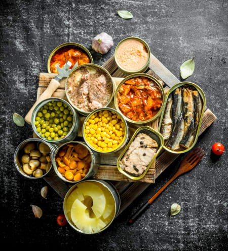 A picture of a variety of canned goods on a table