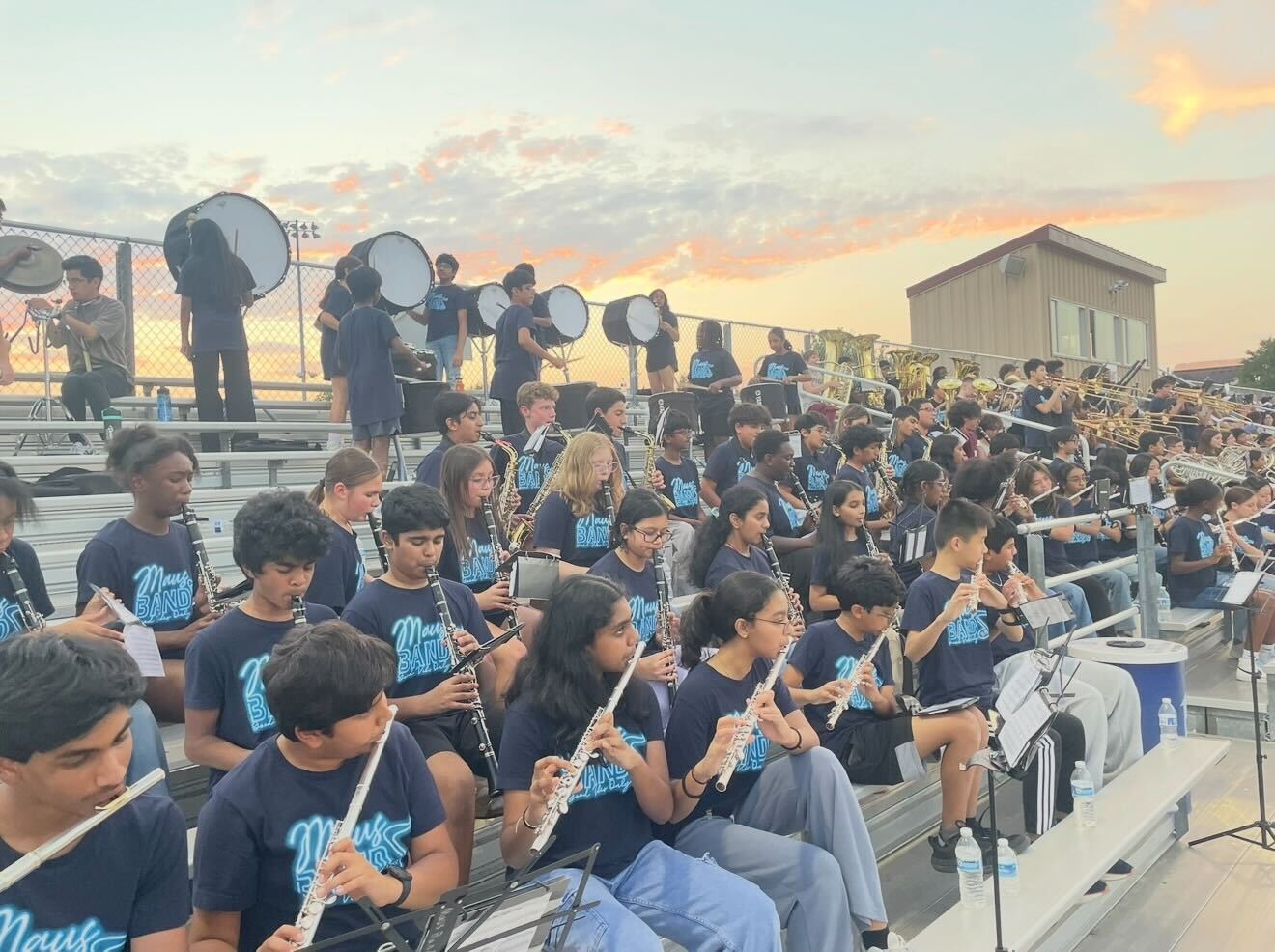 Students from Maus Middle School Band performing at a football game in Frisco ISD.