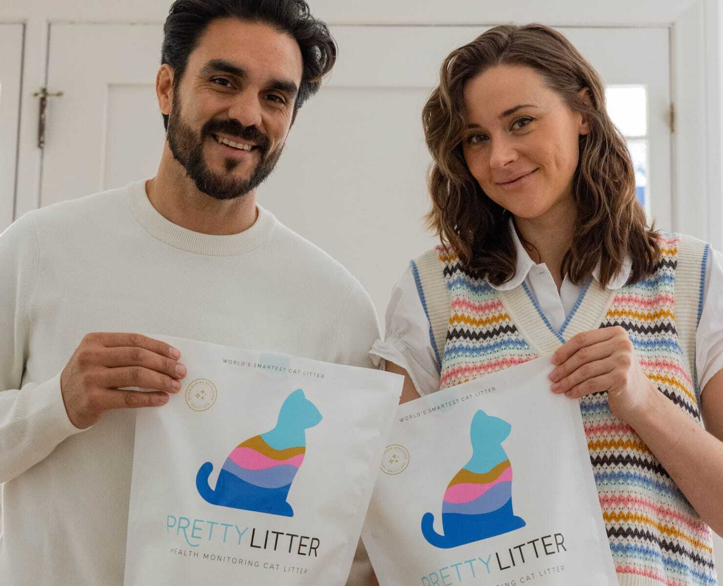 Two PrettyLitter community members holding bags of litter