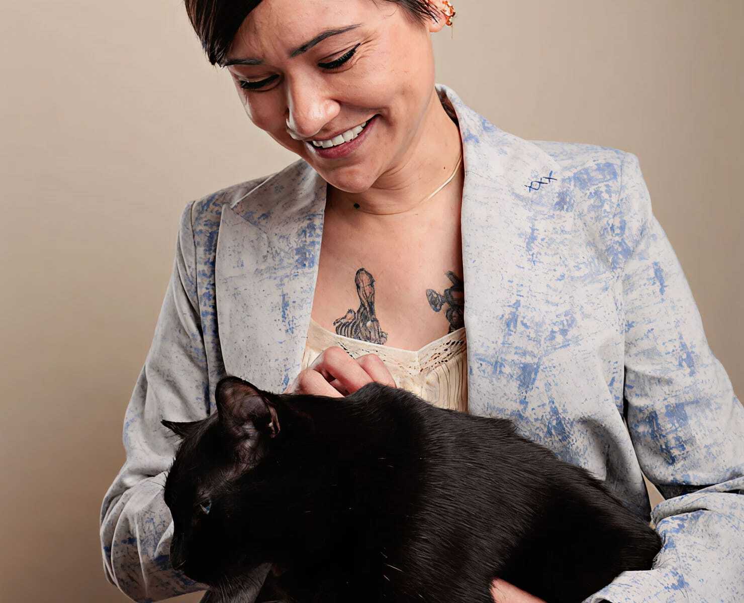 Jennifer Cookson holding a black cat