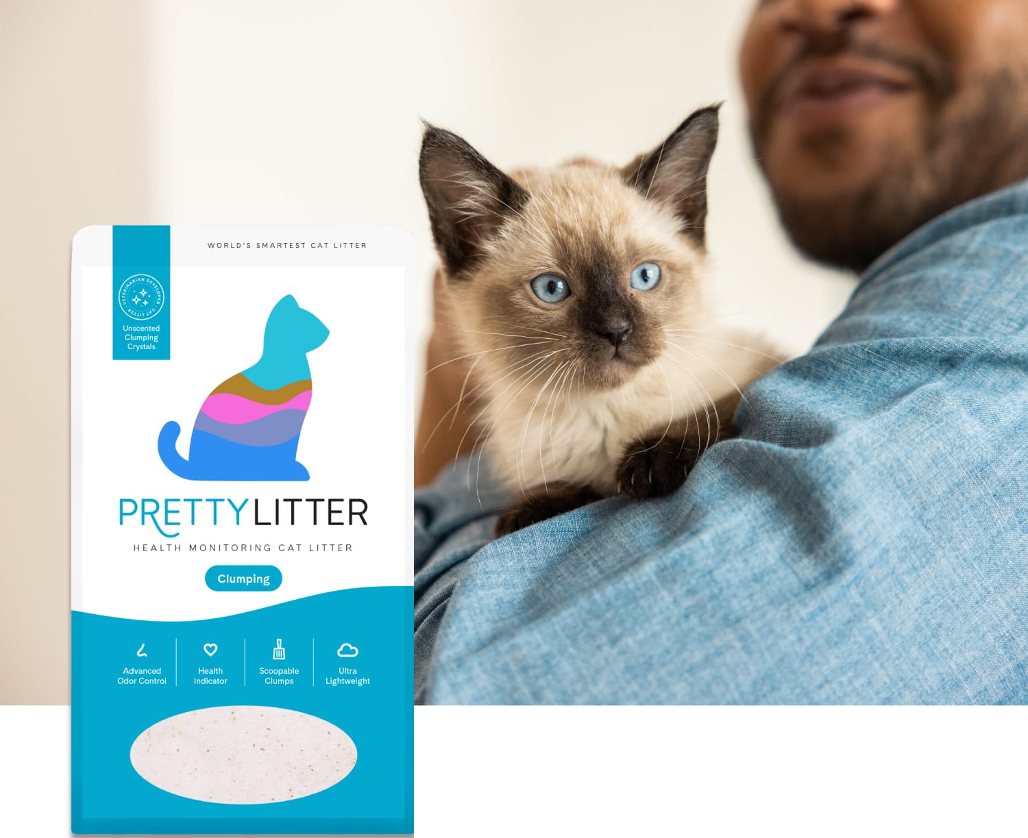Man holding a cat next to PrettyLitter bag